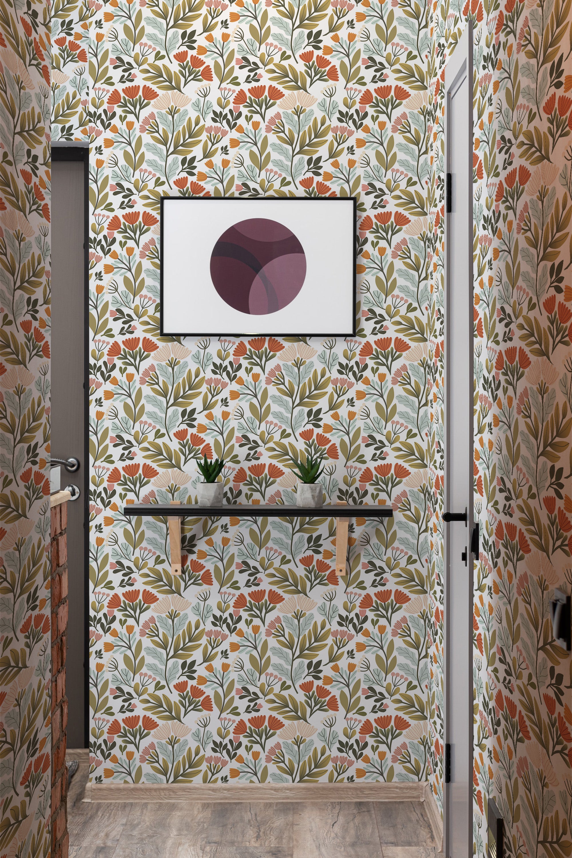 A room with walls covered in a traditional wallpaper pattern of stylized floral motifs in muted shades of orange, red, green, and gray on a cream background.