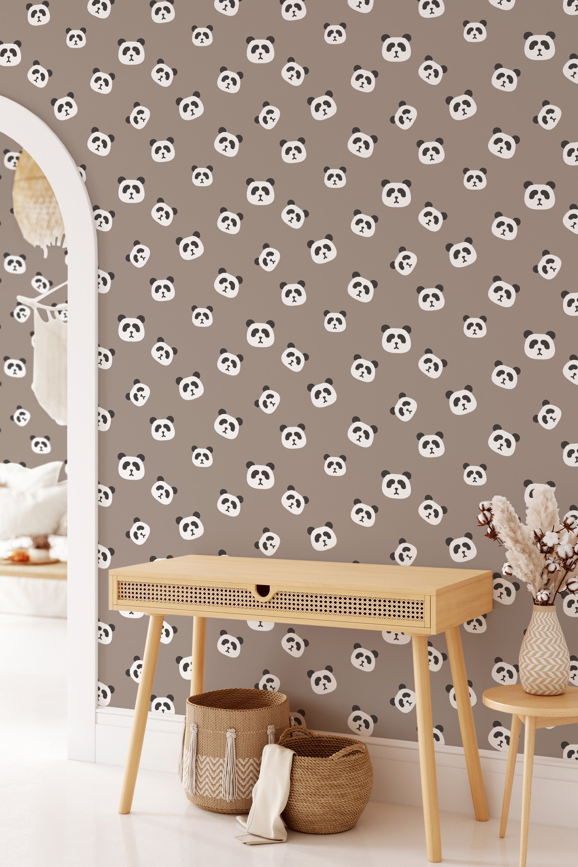 A room's wall covered with panda-themed wallpaper, with repeated patterns of cute panda faces on a neutral background, complementing a modern interior decor, ending with traditional wallpaper.