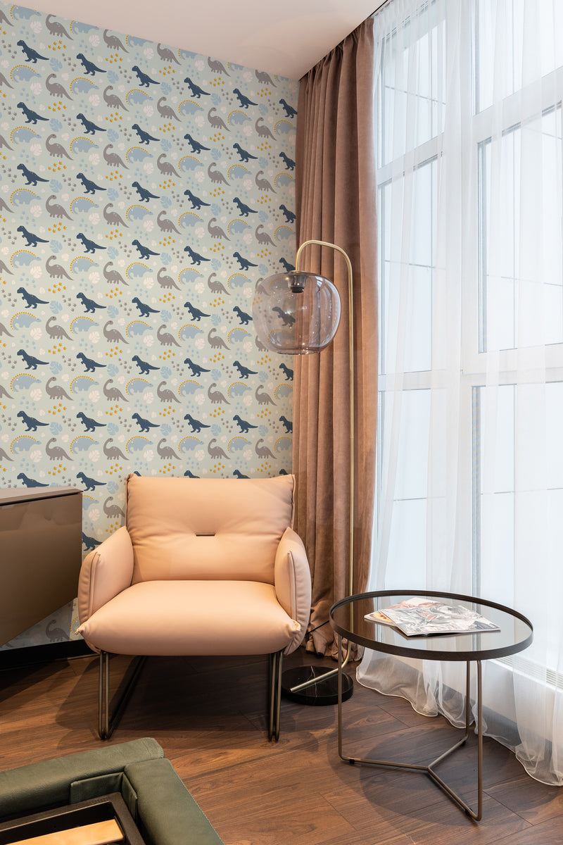 wallpaper stick and peel blue dinosaur pattern modern armchair lamp table reading area