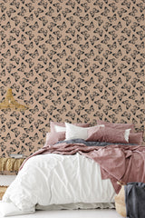 A bedroom with a wall covered in Bold butterfly wallpaper with a repeating pattern of stylized butterflies on a muted background, complementing the cozy bed decor, traditional wallpaper.