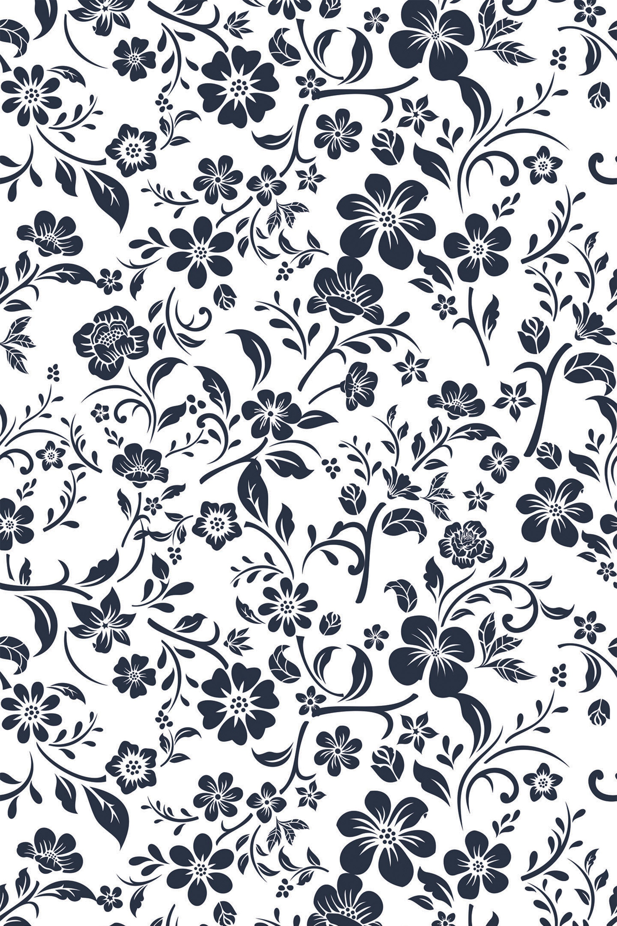 Black and white floral design with intricate, swirling leaves and branches on a retro farmhouse style peel and stick removable wallpaper.