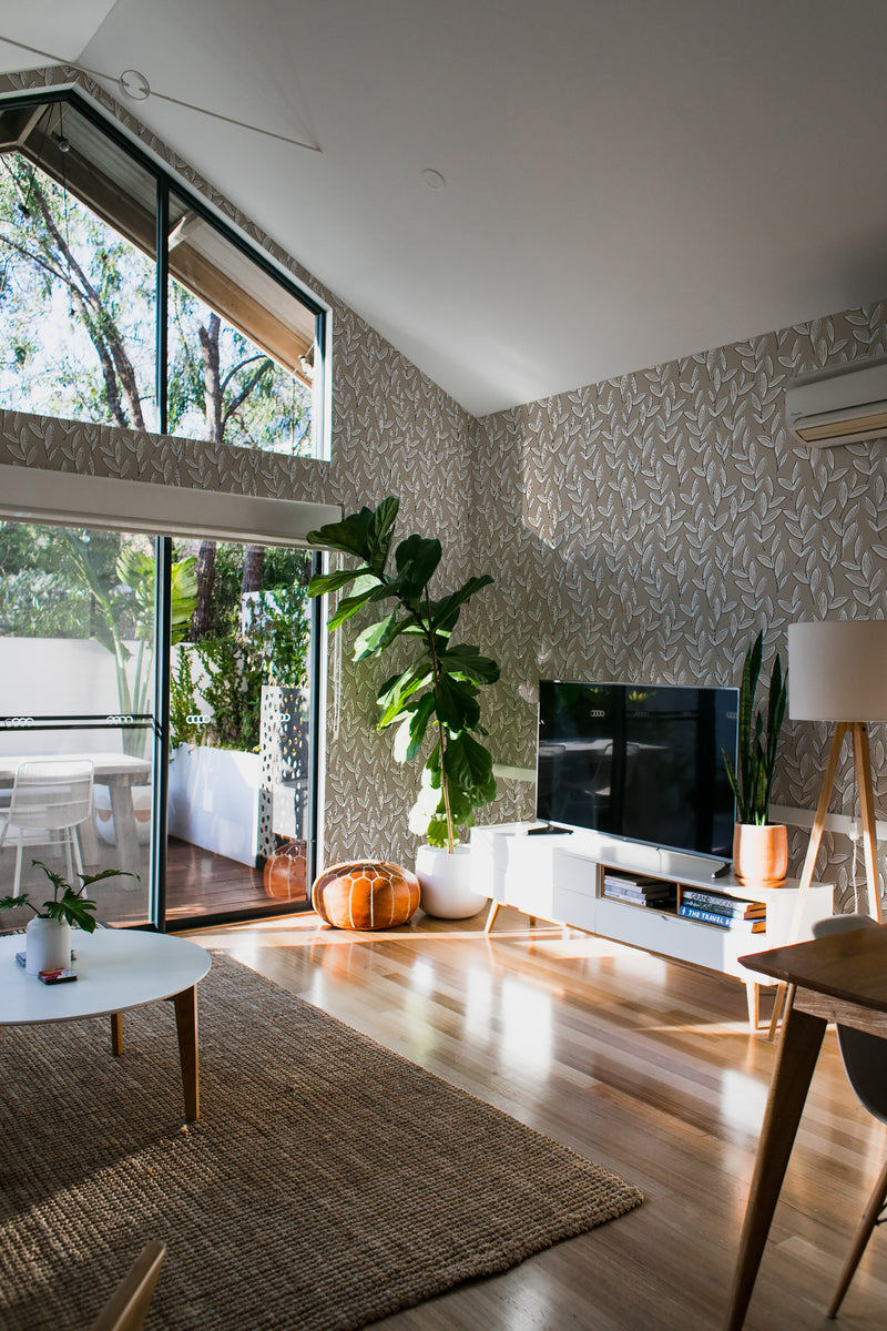 minimalist house terrace green plants living room neutral leaf stick and peel wallpaper