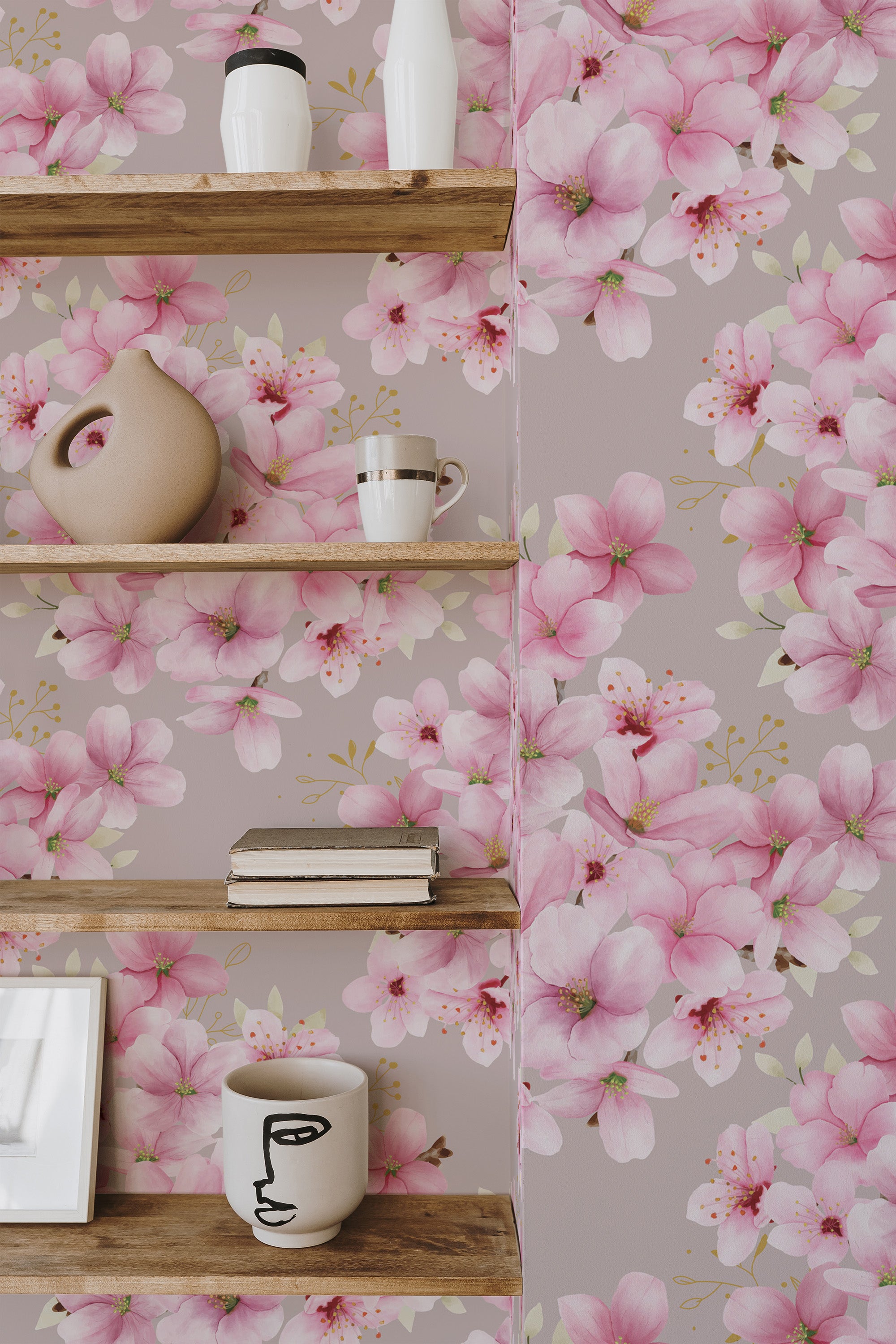 Self-adhesive wallpaper with pink cherry blossoms printed on a light gray background, creating a soft and floral ambiance in the room. The delicate flowers are shown in full bloom, adding a touch of nature to the space.