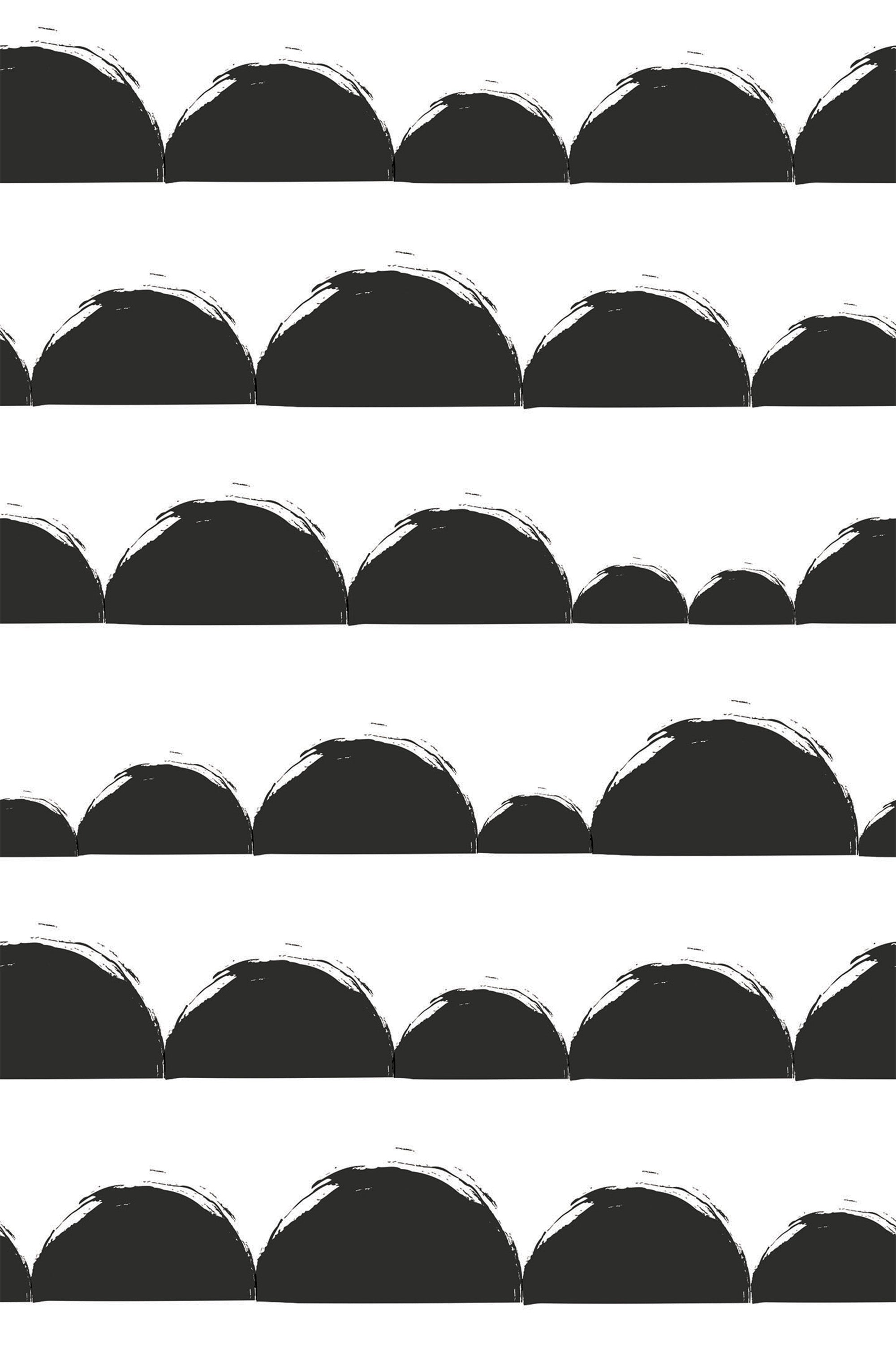 A repeating pattern of black half circles with rough, textured edges on a white background. This bold and minimalist design creates a striking contrast, adding an artistic touch. Peel and stick removable wallpaper.