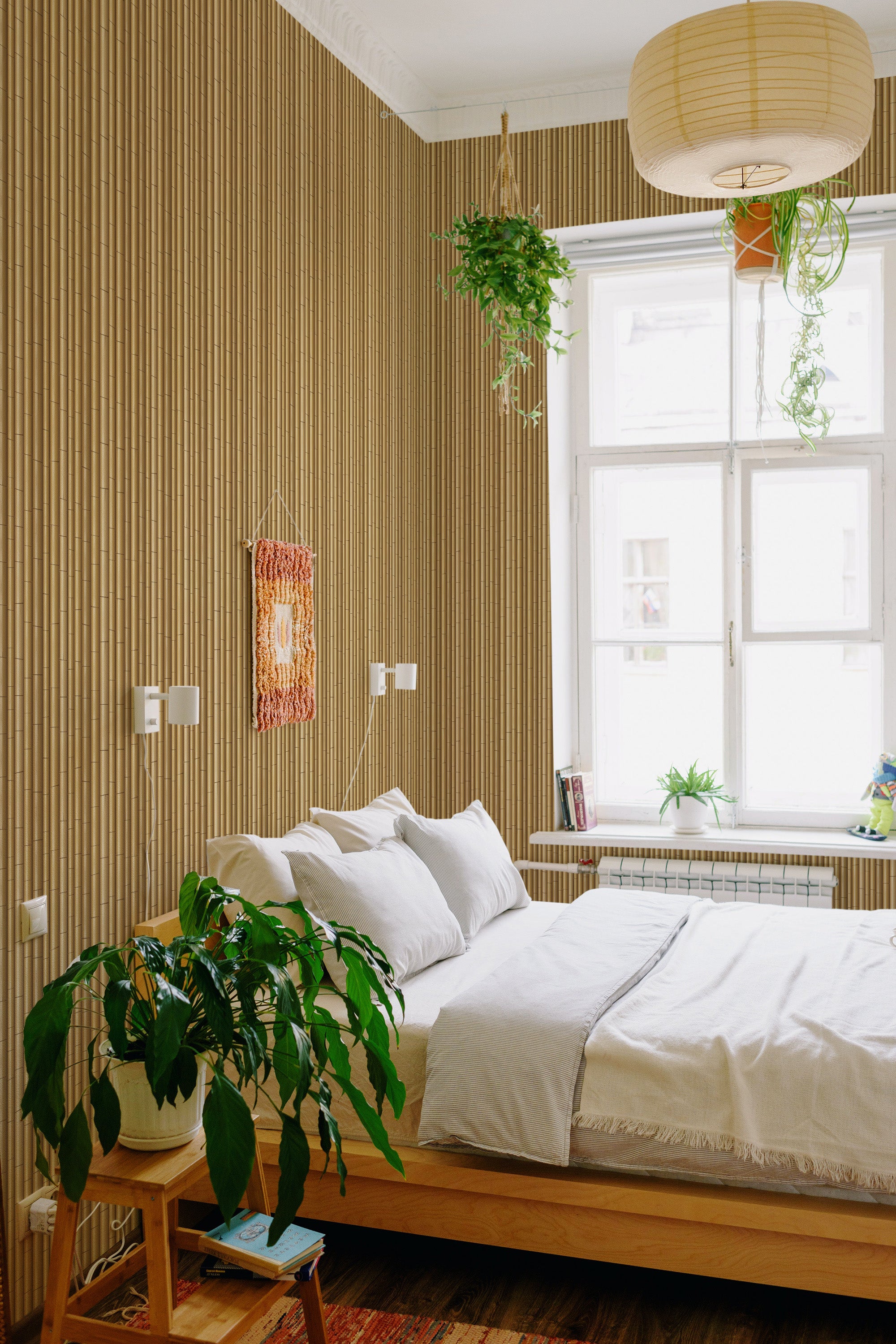 Wallpaper with a vertical bamboo pattern in natural earthy tones, giving the room a warm and organic feel. The bamboo design adds a serene, nature-inspired touch to the walls, enhancing the overall aesthetic of the space. Traditional wallpaper.