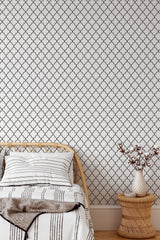 Self-adhesive wallpaper with a classic rustic pattern of interlocking black lattice lines against a white background, adding a touch of elegance and timeless charm to the room.