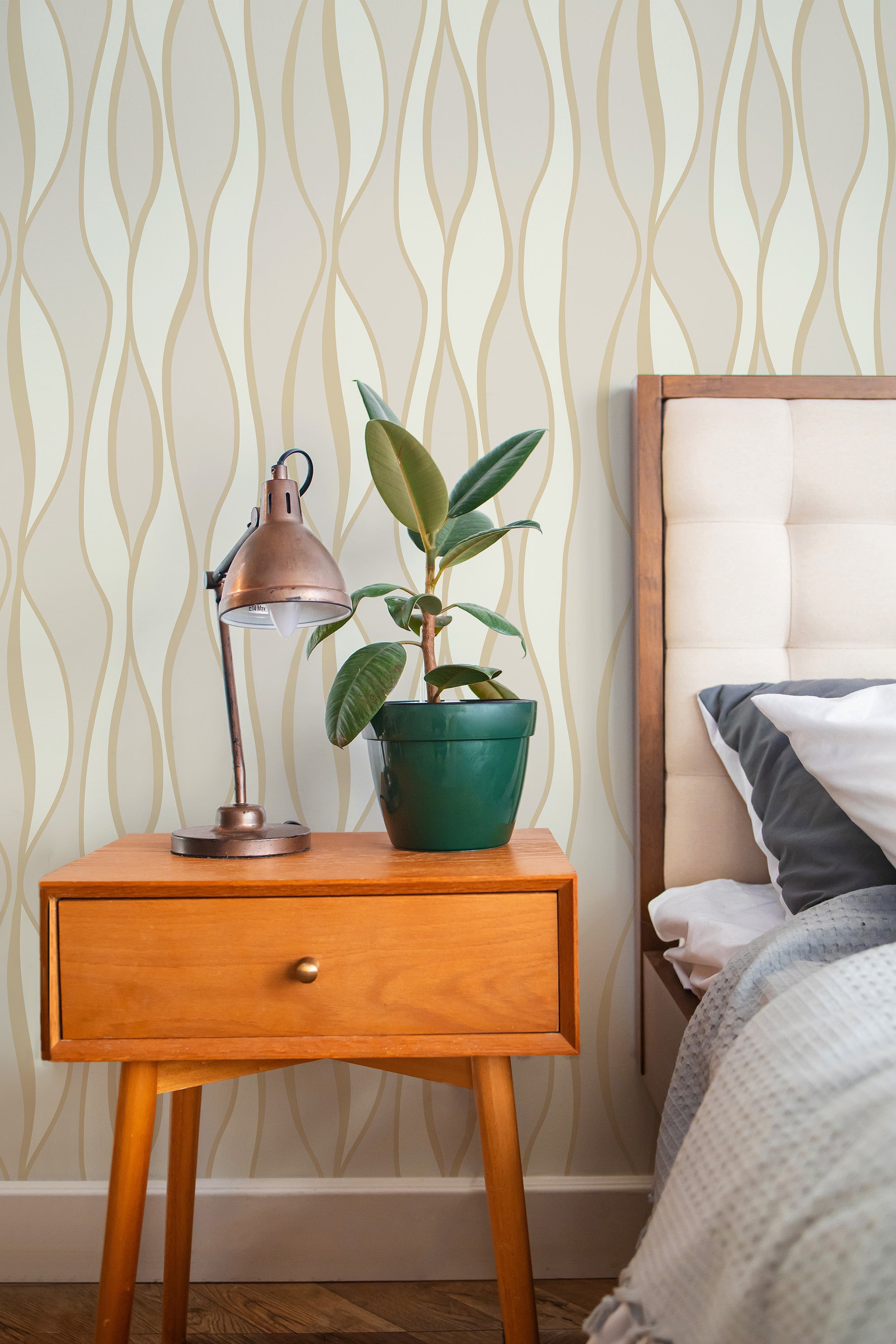 Self-adhesive wallpaper with a Classic design of flowing vertical waves in soft beige and light gold tones, adding a subtle and elegant touch to the room.