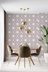 A room with wallpaper adorned with a Boho sun pattern, featuring stylized sun shapes with radiating lines on a muted mauve background. Traditional wallpaper.