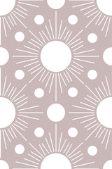 A repeating wallpaper with a minimalist Boho sun design, featuring white circular suns surrounded by radiating lines and smaller dots on a soft taupe background. Peel and stick removable wallpaper.