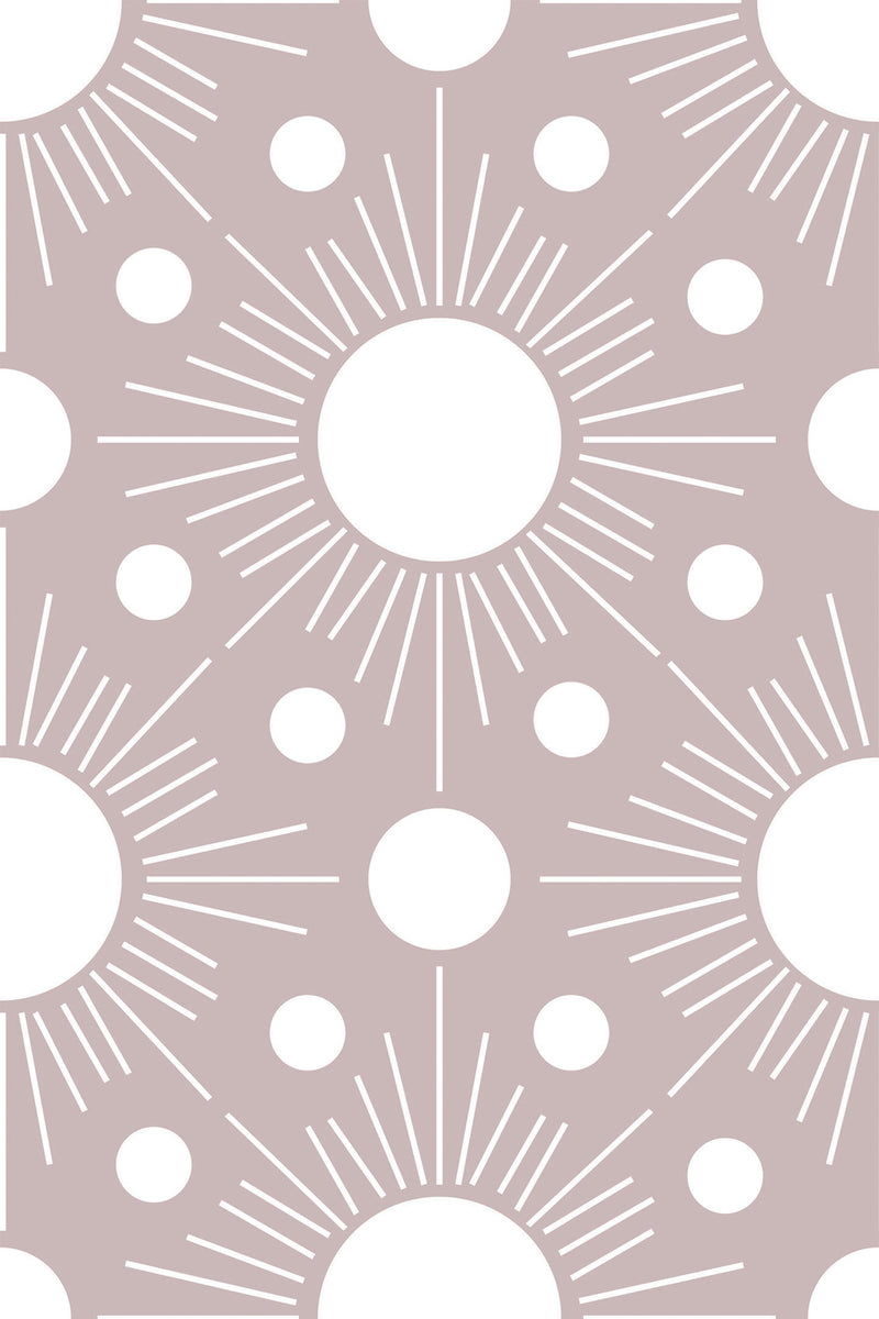 A repeating wallpaper with a minimalist Boho sun design, featuring white circular suns surrounded by radiating lines and smaller dots on a soft taupe background. Peel and stick removable wallpaper.