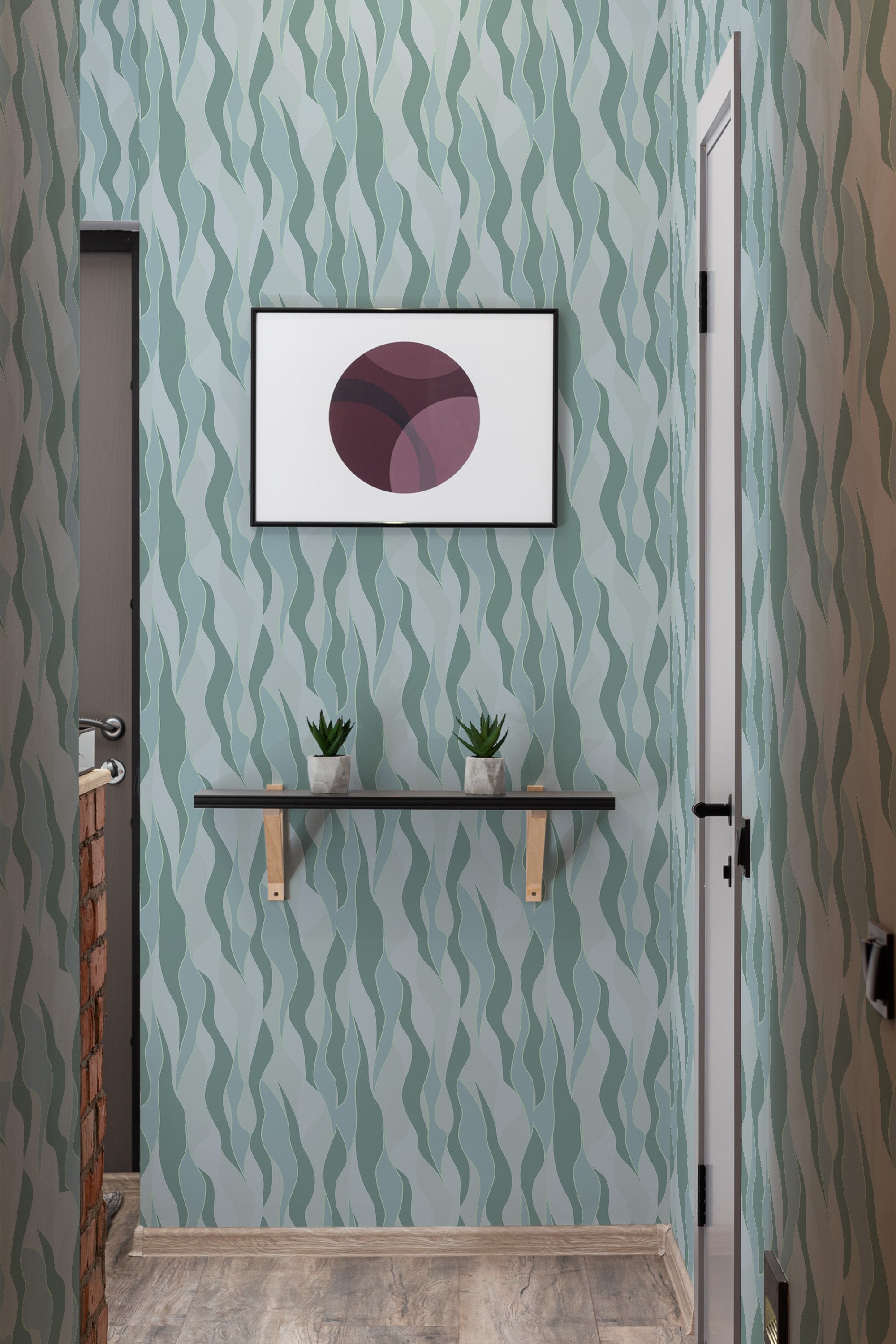 Green and blue wave-patterned wallpaper with a natural design, resembling flowing leaves, on the wall of a small room. The wallpaper creates a serene, organic atmosphere, suitable for a modern yet traditional room.