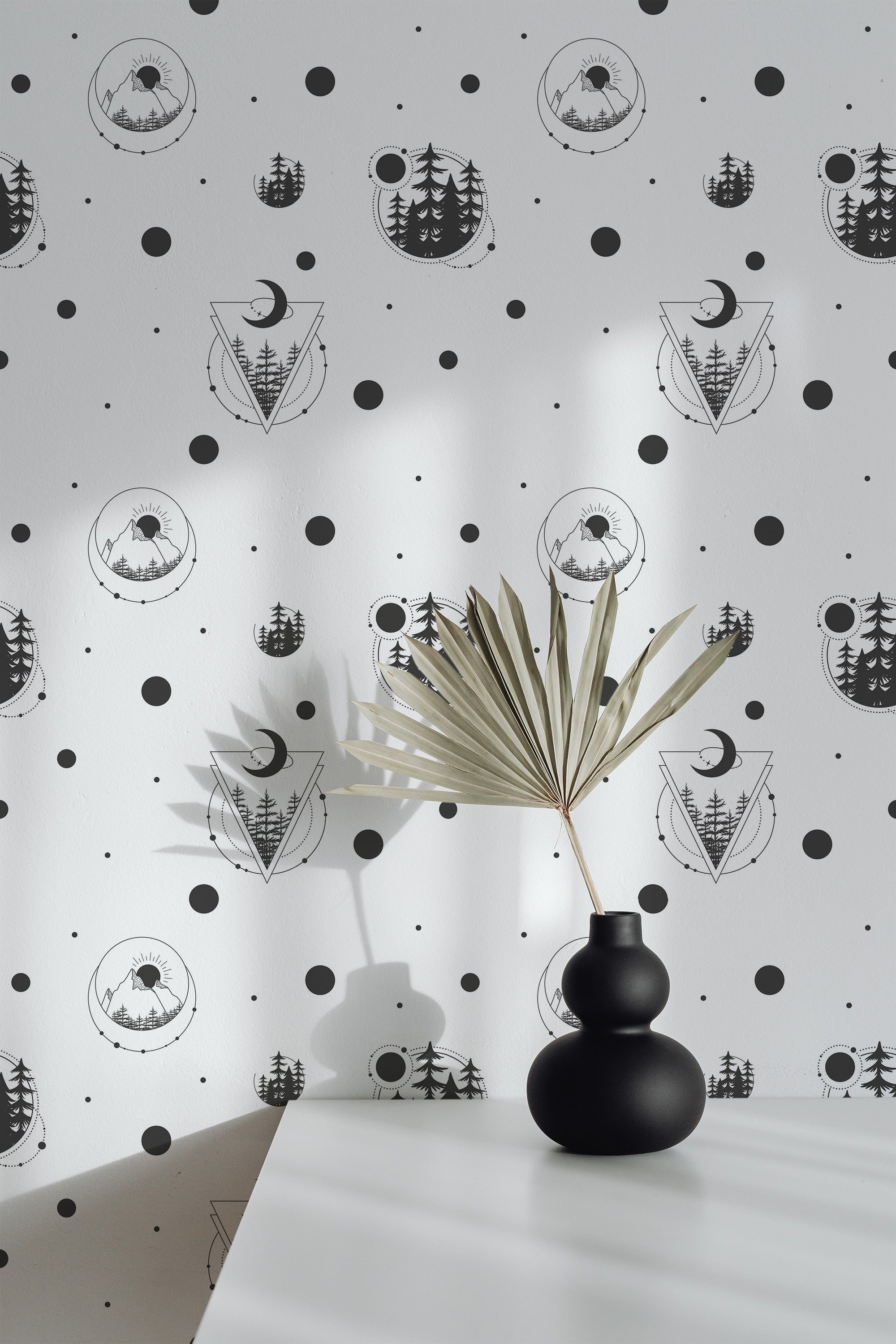 Self-adhesive wallpaper with a celestial design, displaying black and white illustrations of trees, moons, and geometric shapes, arranged in a repeating pattern with dots scattered throughout.