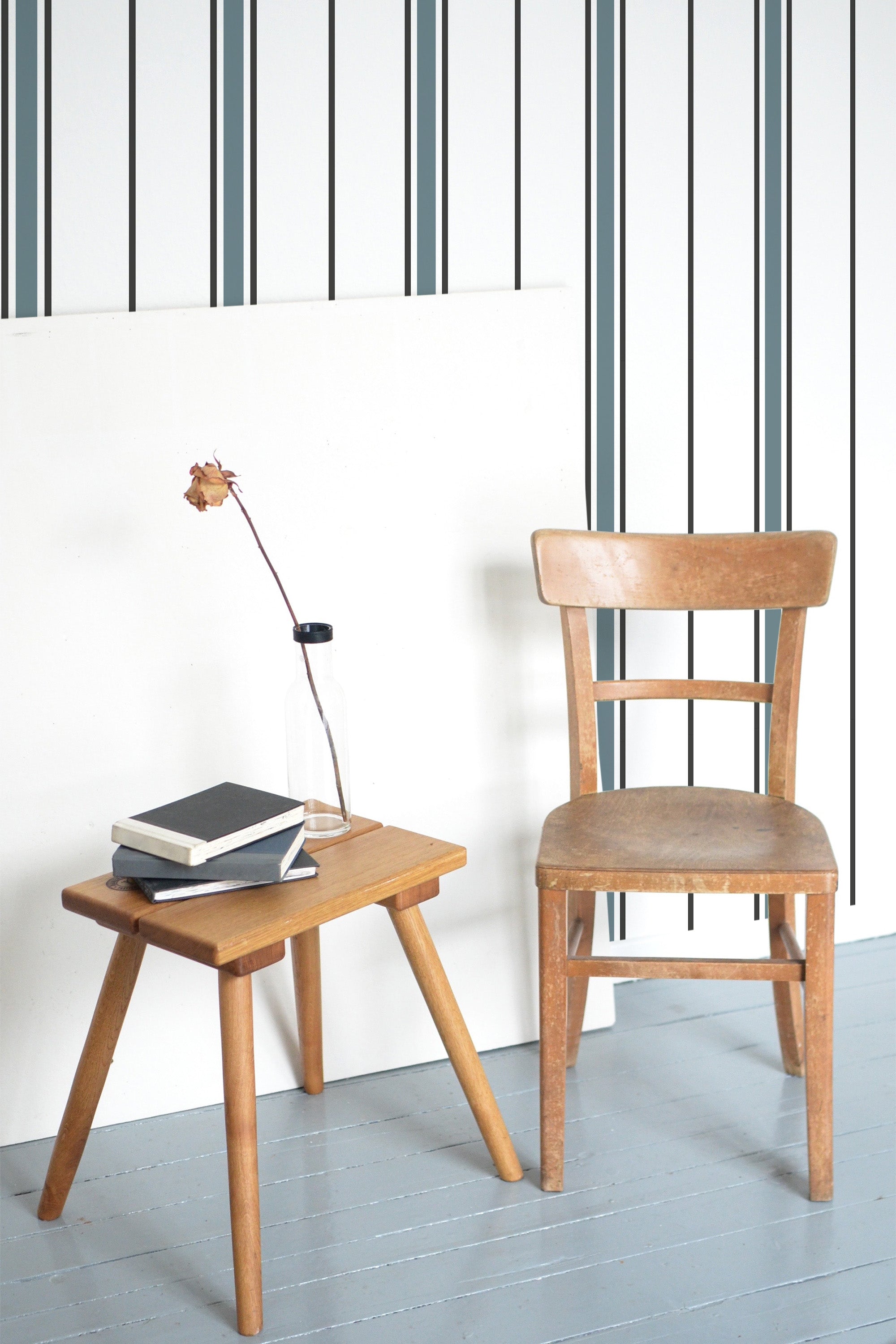 Self-adhesive wallpaper with a fabric stripe design, featuring alternating dark and light vertical stripes that create a modern and clean look.