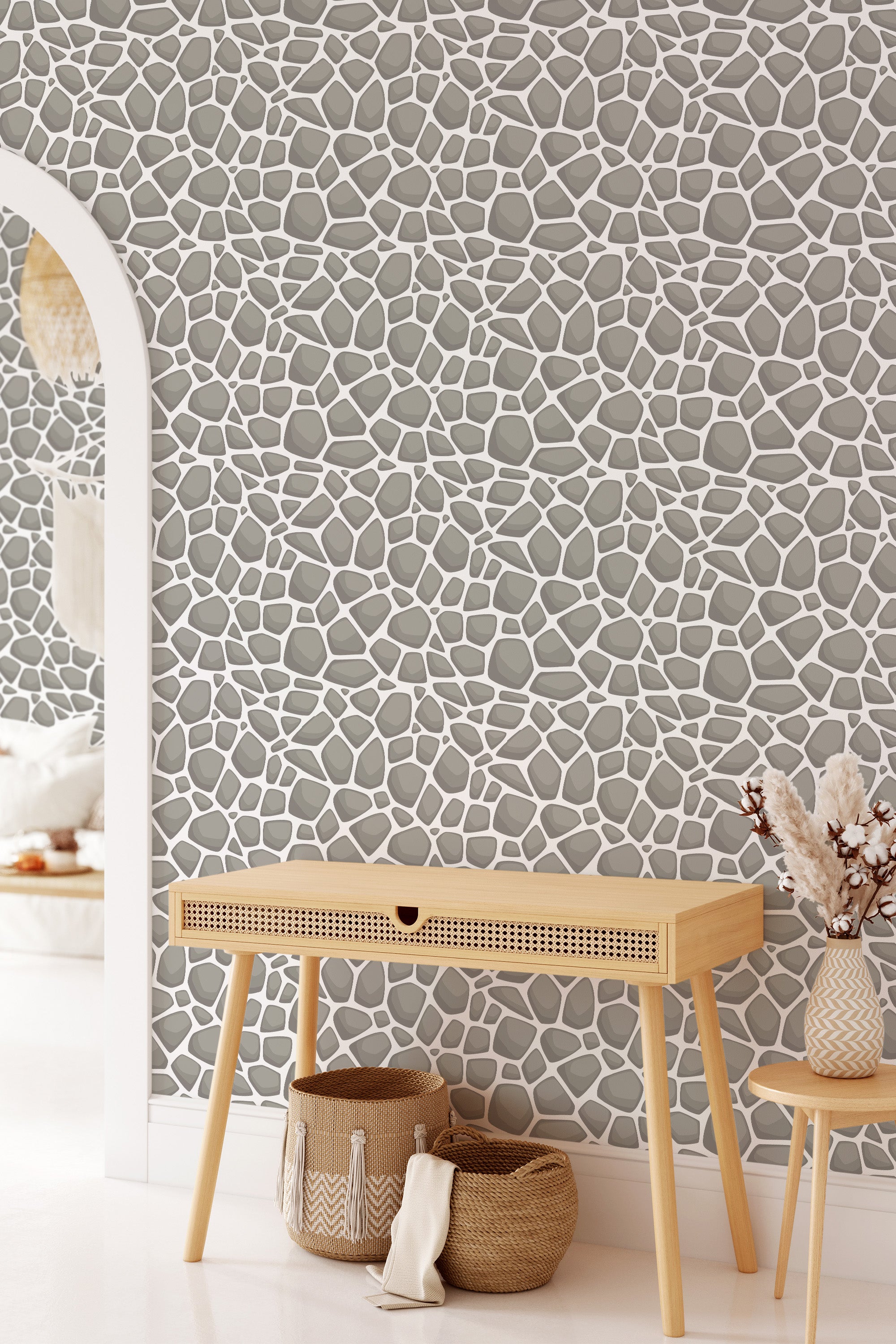 A room with stone-patterned wallpaper, featuring an irregular arrangement of gray stones accentuated by white grout lines, creating a natural, organic look. Traditional wallpaper.