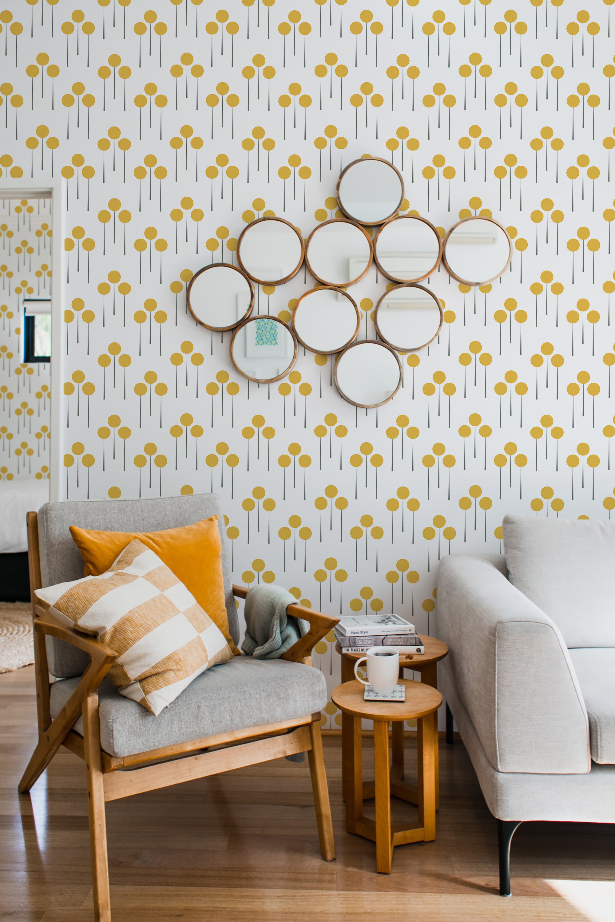 Yellow retro dots pattern with symmetrical, repeating circles and vertical lines on a white background, creating a vintage-inspired look on traditional wallpaper.