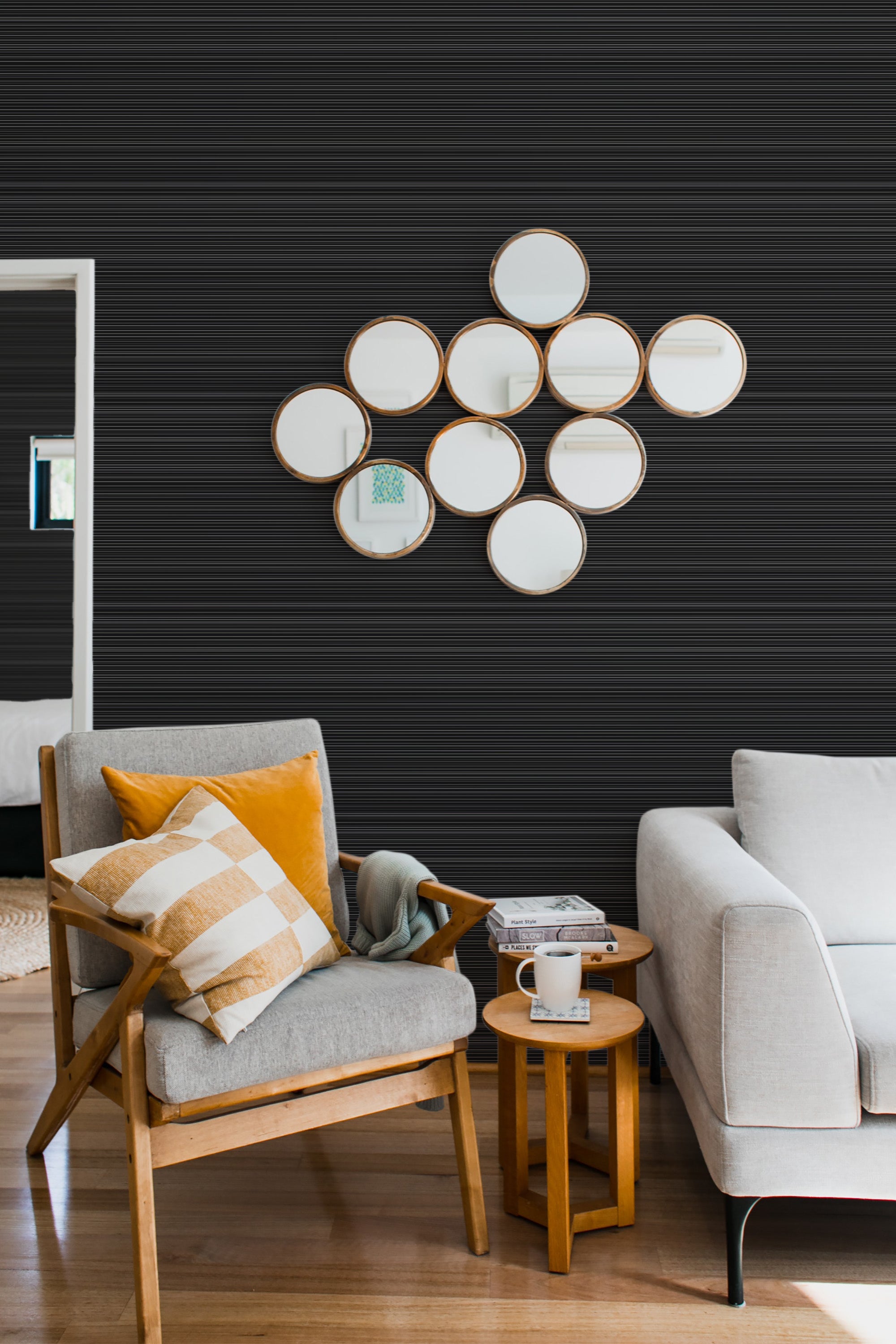 Black striped textured wallpaper with subtle horizontal lines creates a sleek, modern look in a cozy living space with wooden furniture and neutral d��cor, evoking the style of traditional wallpaper.
