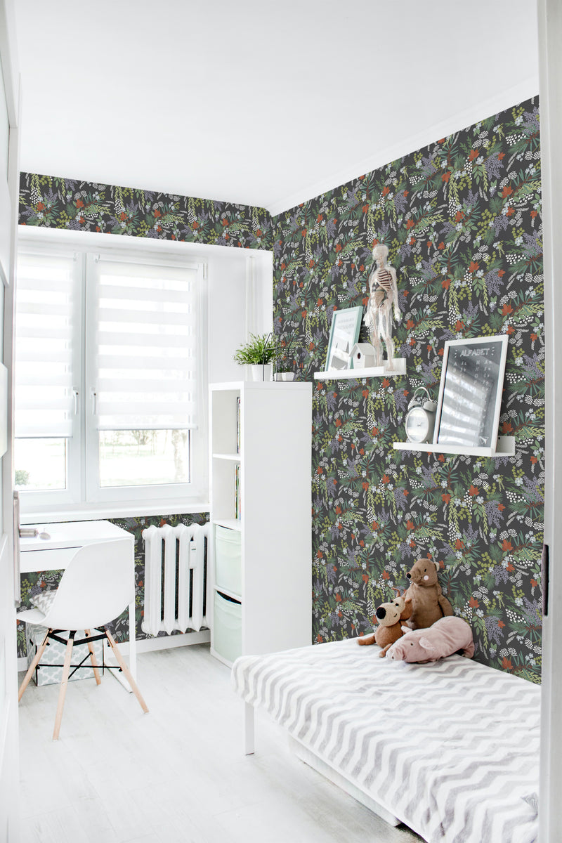 A room with dark-colored wallpaper displaying a detailed pattern of night flowers, leaves, and foliage in rich, earthy tones covering the walls. Traditional wallpaper.