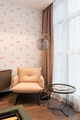 wallpaper stick and peel pink butterfly pattern modern armchair lamp table reading area