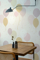 Self-adhesive wallpaper with a playful Balloon design featuring soft pastel-colored balloons in shades of pink, beige, and gray, floating gently against a light background.