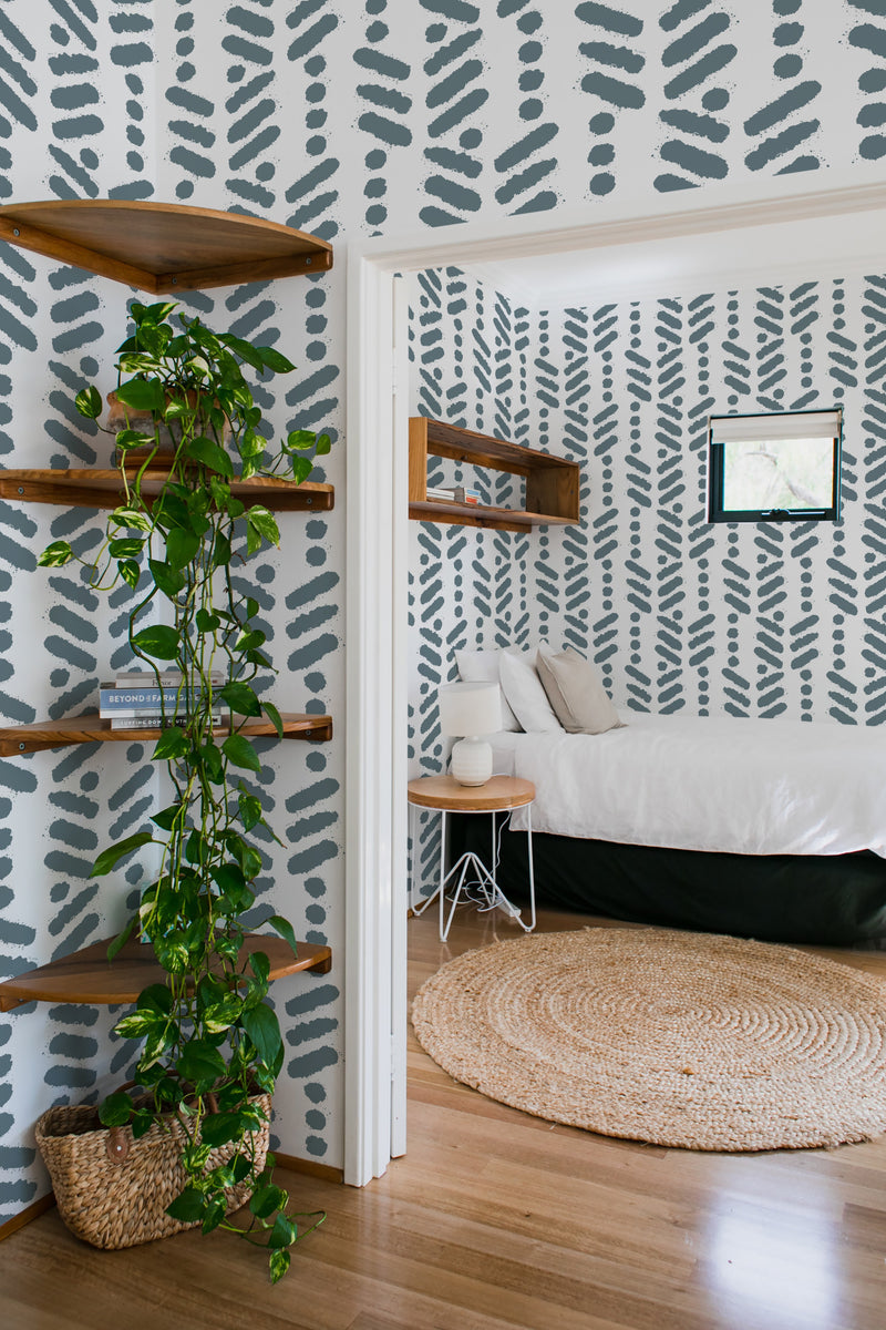 bedroom cozy interior green plants round carpet herringbone brush stroke peel & stick wallpaper