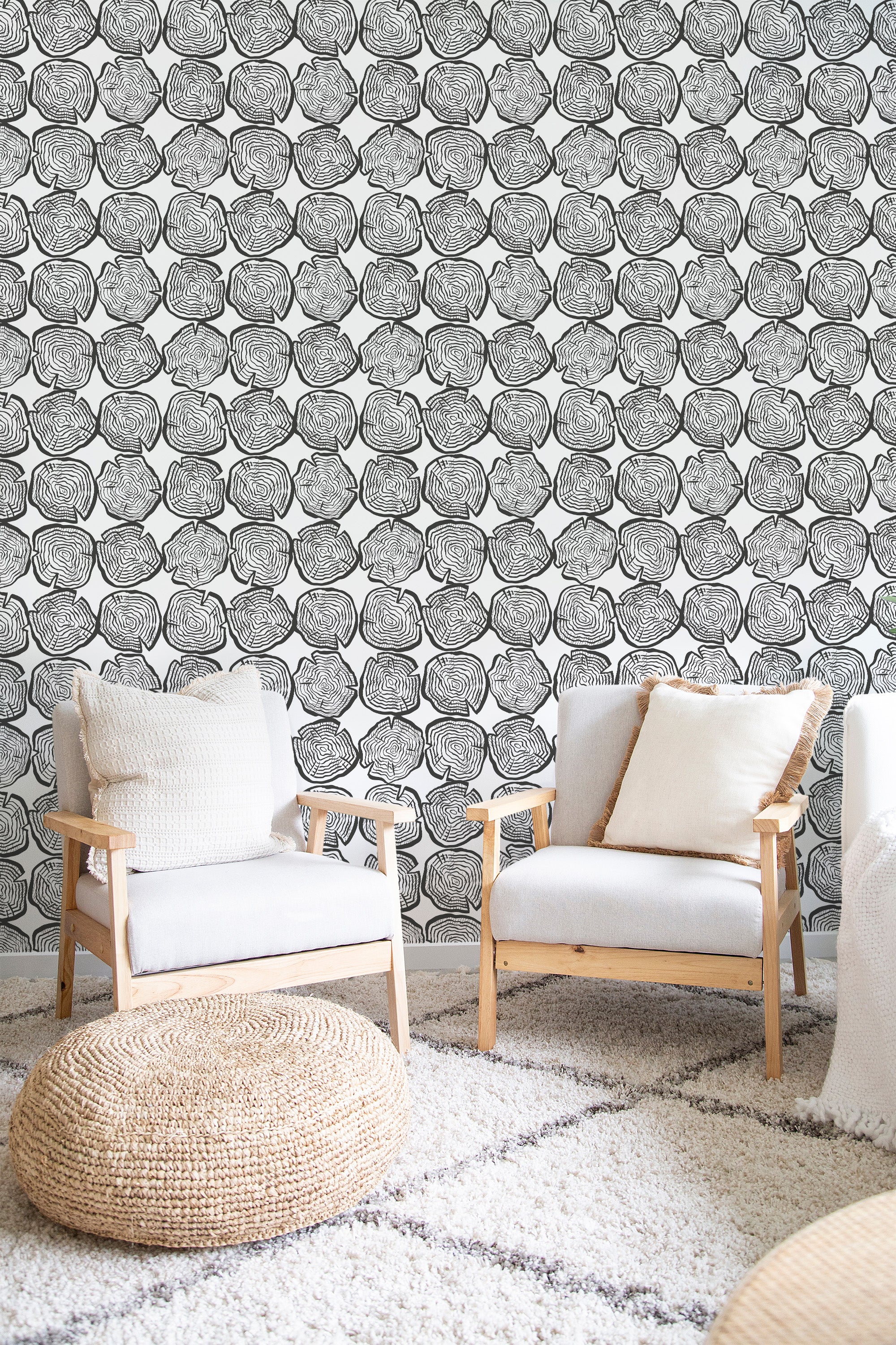 Black and white wallpaper with intricate wood grain patterns, creating a textured appearance similar to cross-sections of tree trunks. Traditional wallpaper.