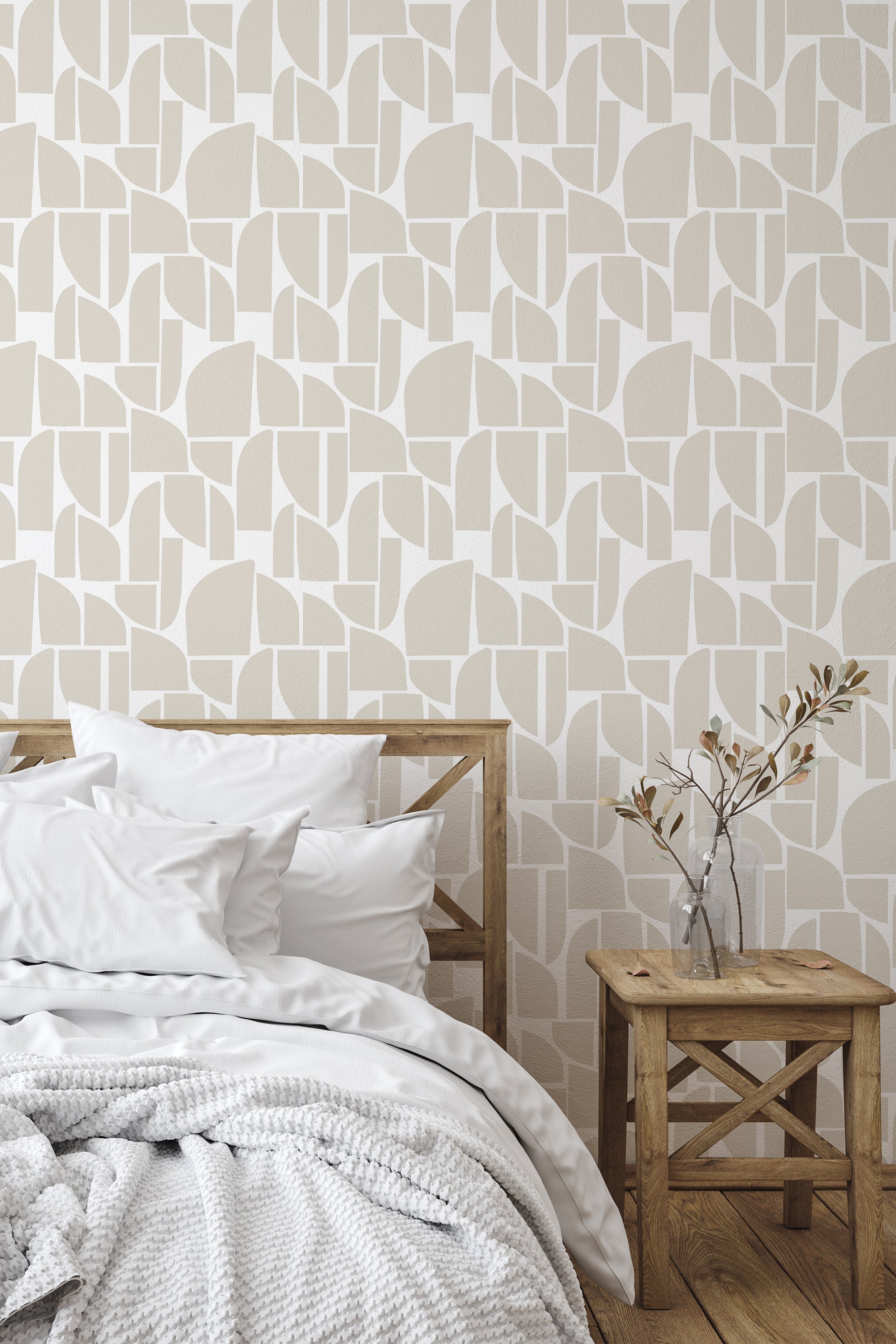 Self-adhesive wallpaper with abstract shapes in neutral tones, enhancing the room's ambiance above a wooden bed and a side table with a simple vase.