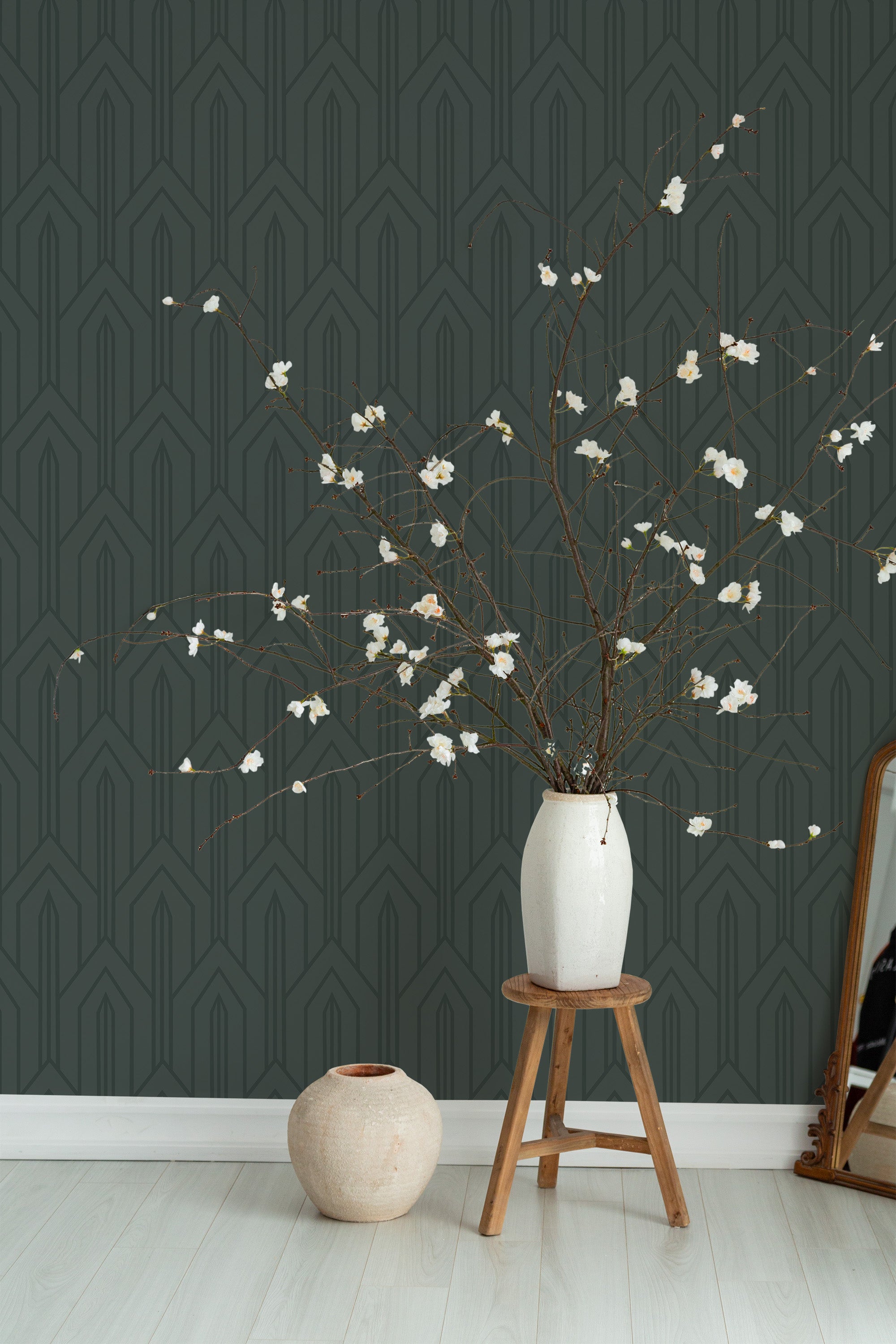 Self-adhesive dark art deco wallpaper in a deep green shade with geometric patterns, adding a bold and sophisticated touch to the room.