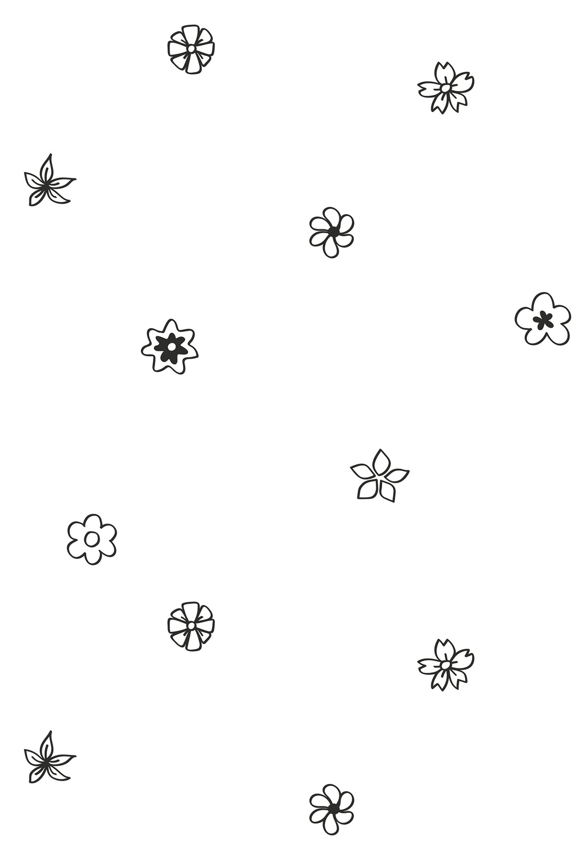 Minimalistic wallpaper with scattered tiny black outline flowers on a white background. Peel and stick removable wallpaper.