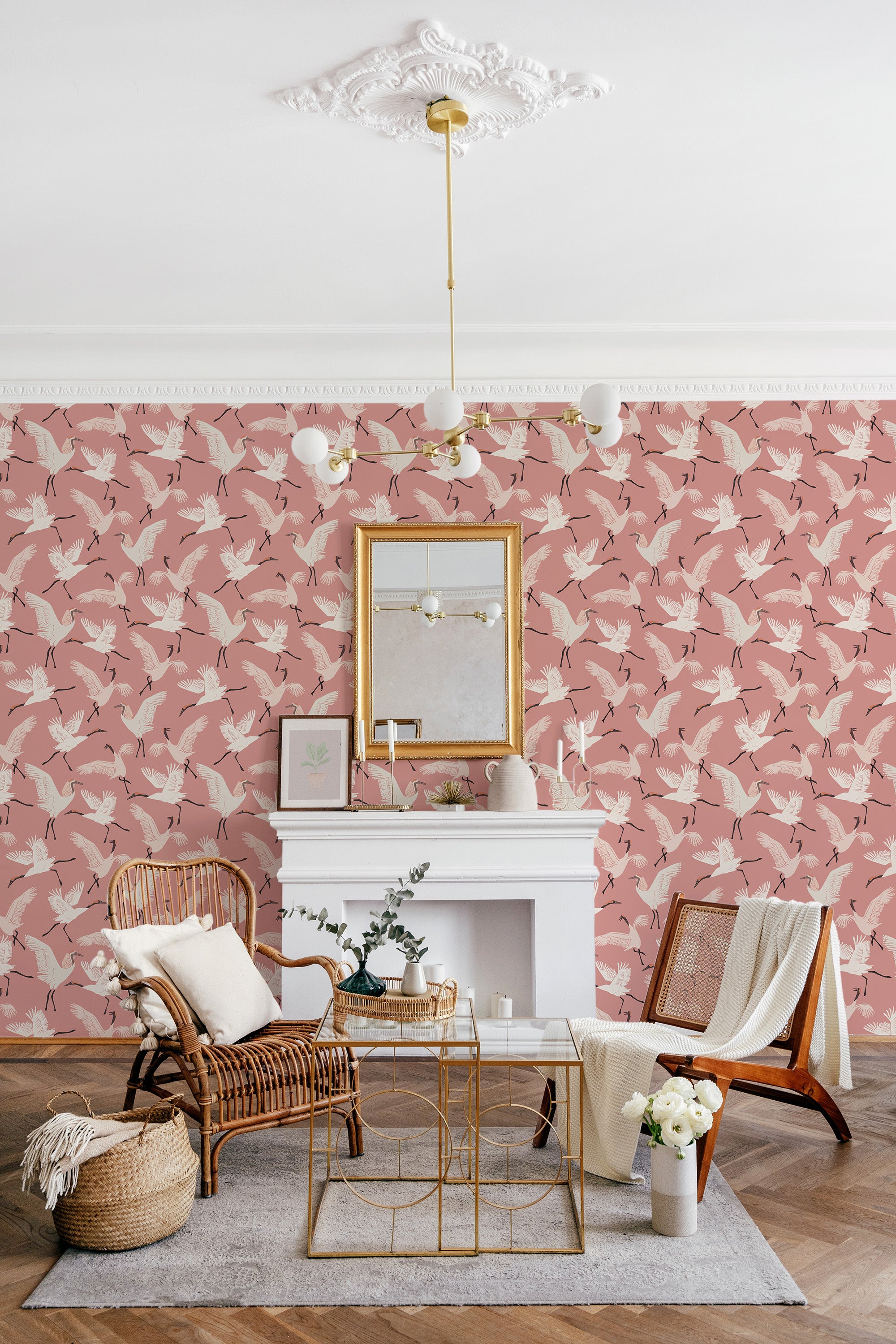 Pink wallpaper with white cranes in flight among delicate branches, creating an elegant and serene atmosphere. Traditional wallpaper.