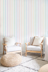 cozy living room soft armchairs pillows rainbow stripe wall decor