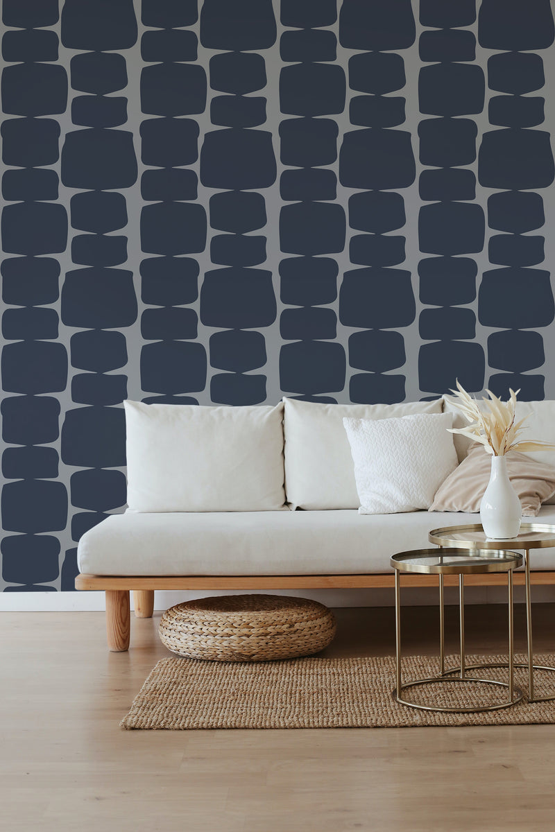 Navy retro shape wallpaper with a geometric pattern of irregular, dark blue, rounded rectangles vertically aligned on a light background. Traditional wallpaper.