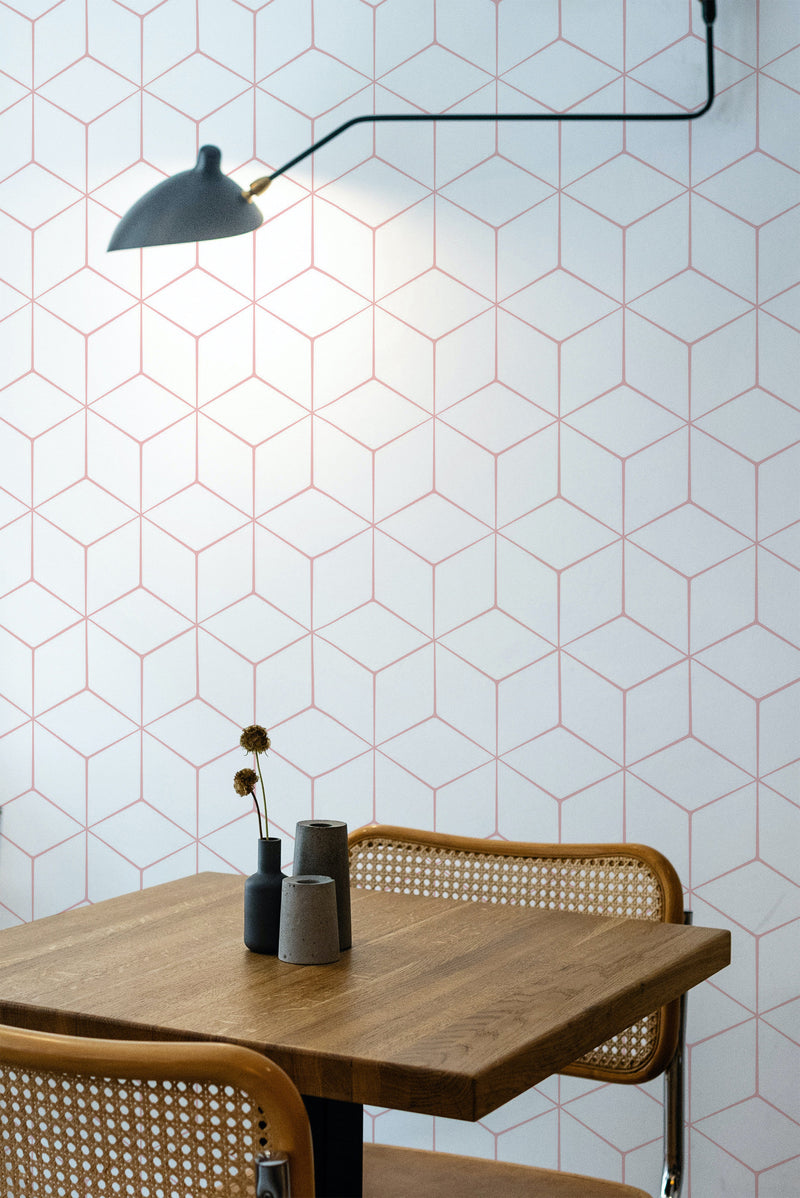 Self-adhesive hexagon wallpaper with a geometric pattern in light pink lines on a white background, creating a modern and minimalist look in the room.