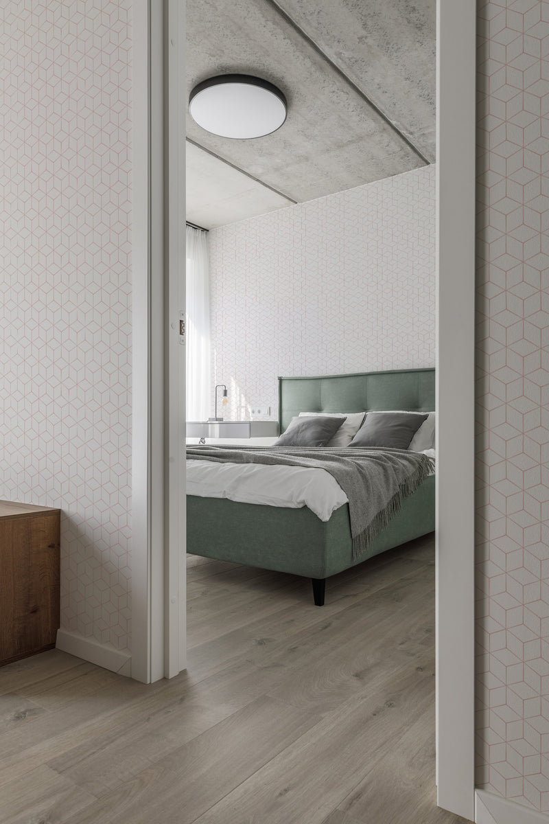 A room with a subtle hexagon pattern on white wallpaper, adding a geometric touch to the minimalist interior. Traditional wallpaper.