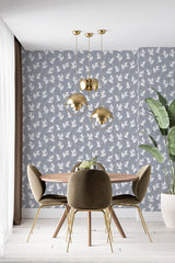 modern dining area velour chair plant swan print accent wall