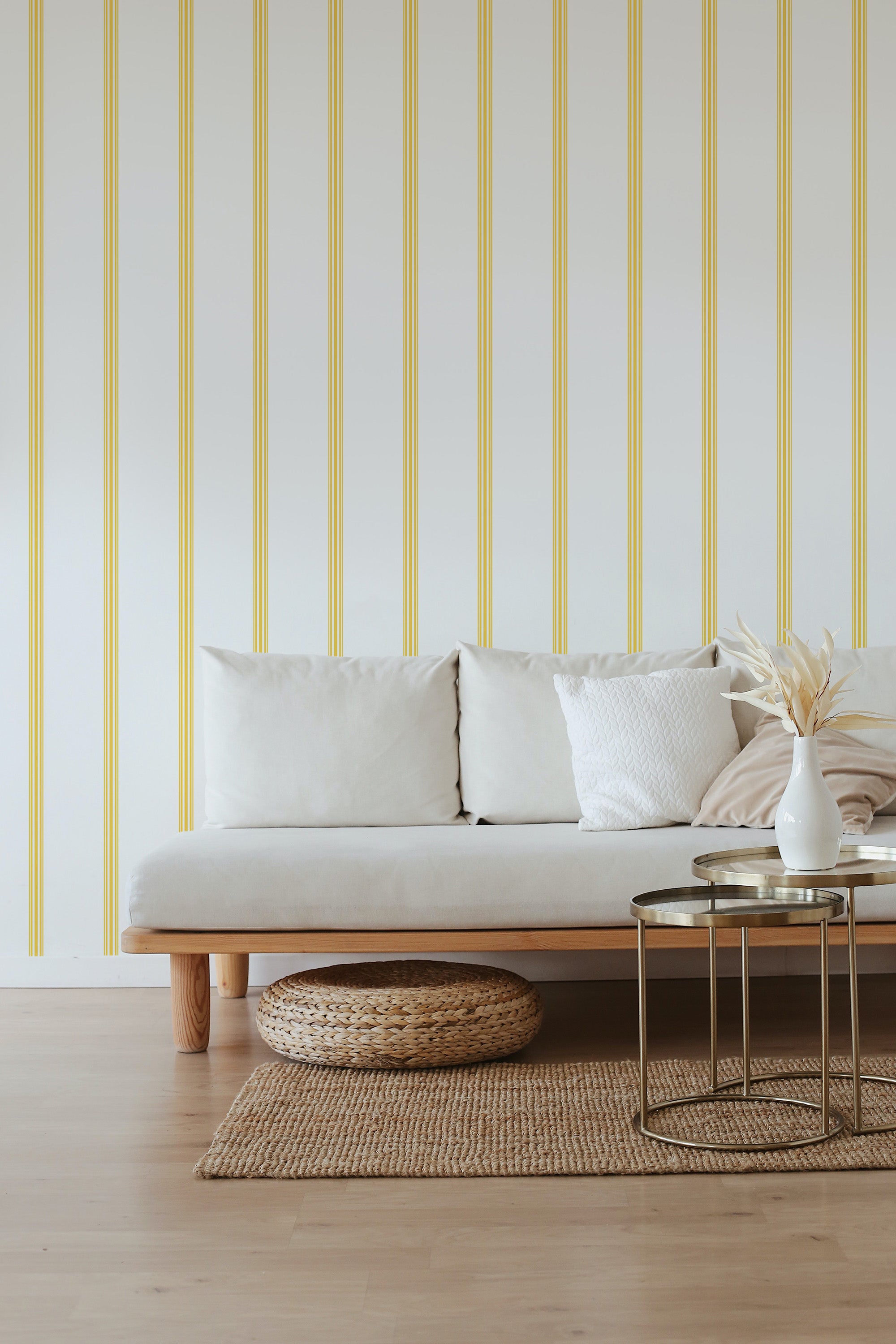 A room with French stripe wallpaper in alternating yellow and white vertical bands, creating a timeless and traditional wallpaper.