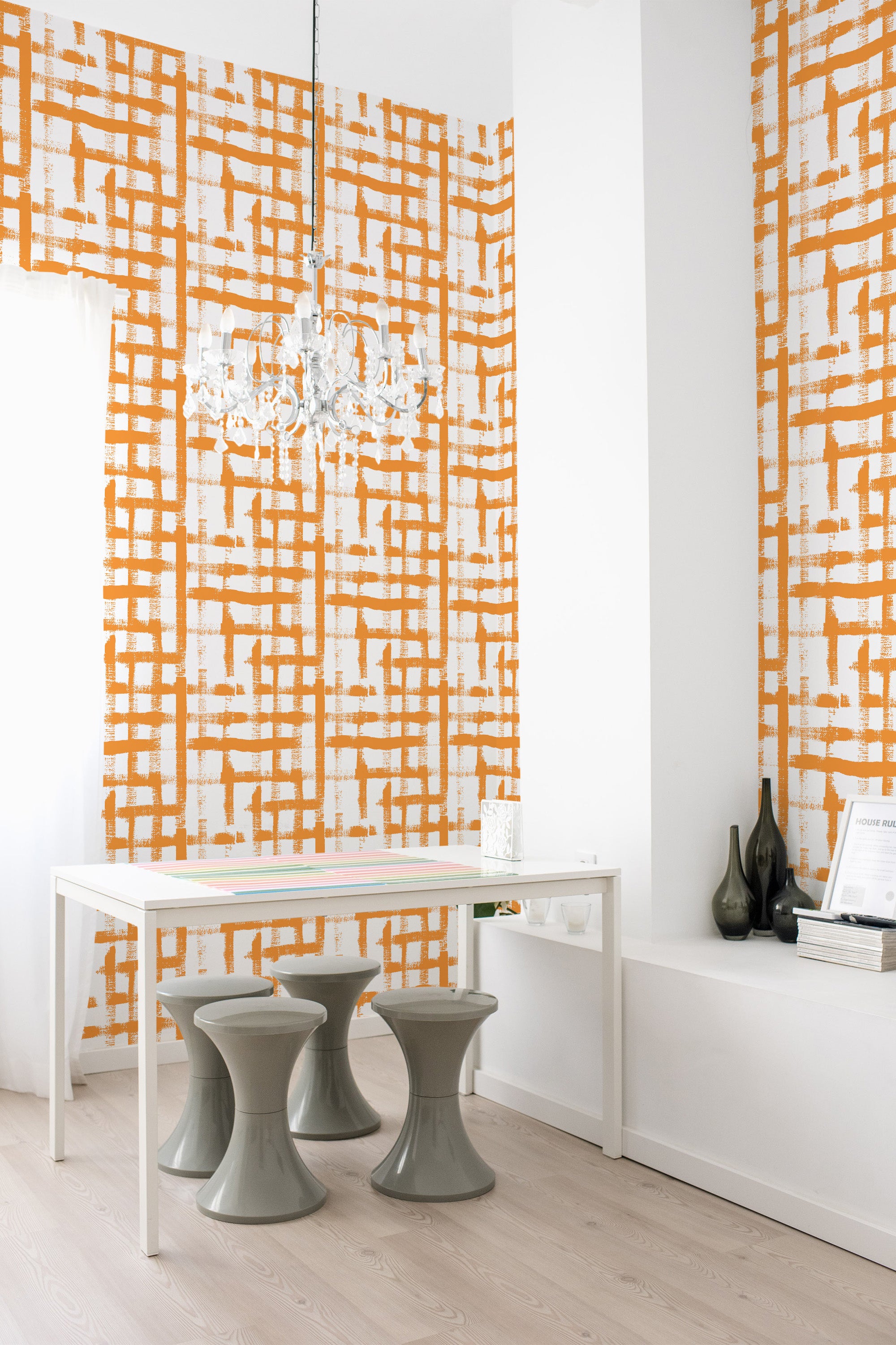 A room with walls adorned with an orange and white brush grid pattern, reminiscent of a hand-painted design, giving the space a warm, artistic feel. Traditional wallpaper.