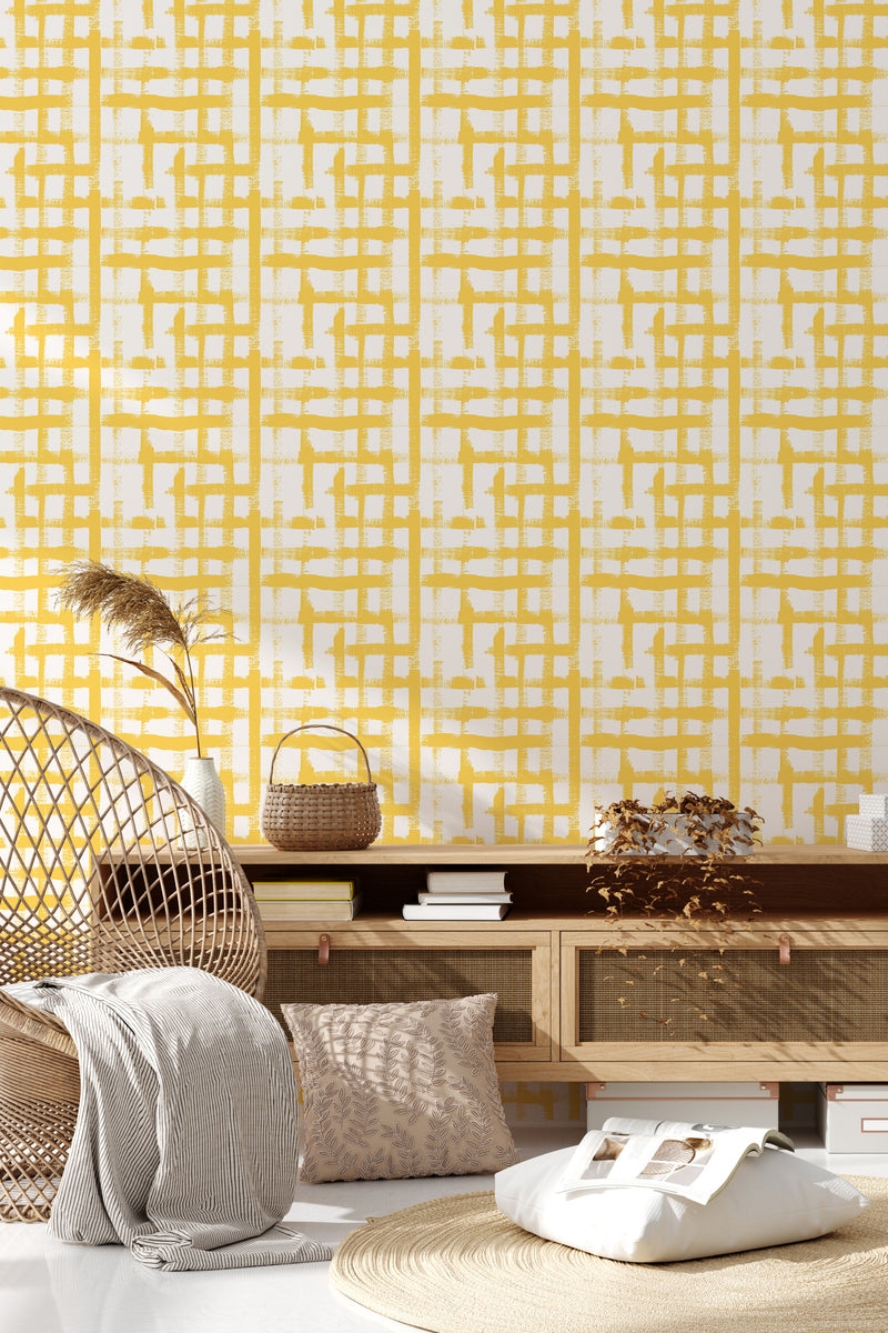 A room with a yellow brush grid pattern wallpaper displayed, creating a vibrant and textured geometric design. Traditional wallpaper.