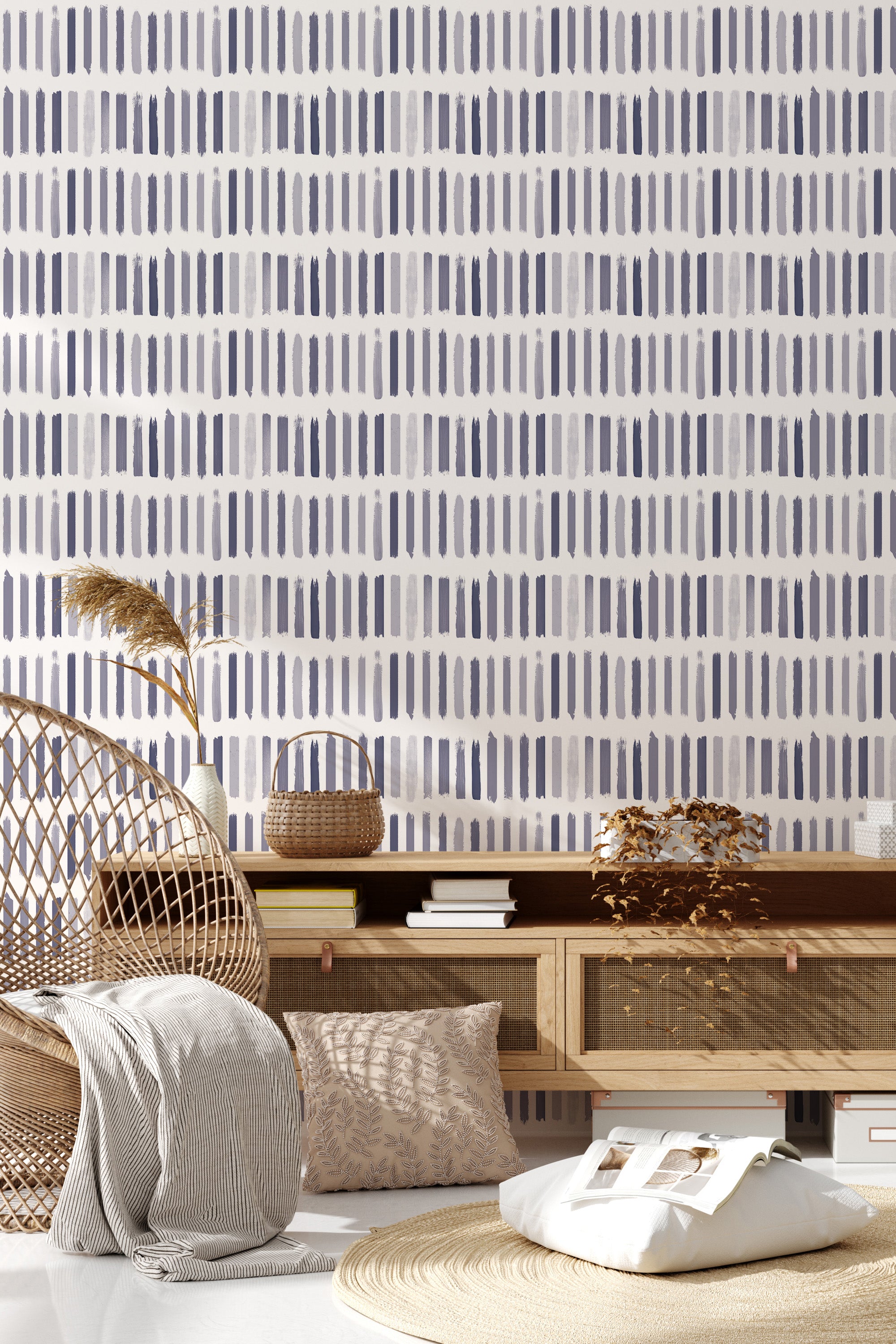 The wallpaper design has a repeating pattern of vertical brushstroke lines in varying shades of blue and gray, forming an abstract and modern look on a white background, traditional wallpaper.