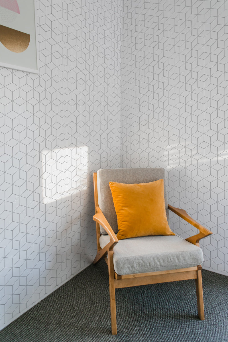 Geometric wallpaper with a repeating hexagonal pattern in fine, light grey lines on a white background, creating a subtle and modern design that complements the room. Traditional wallpaper.