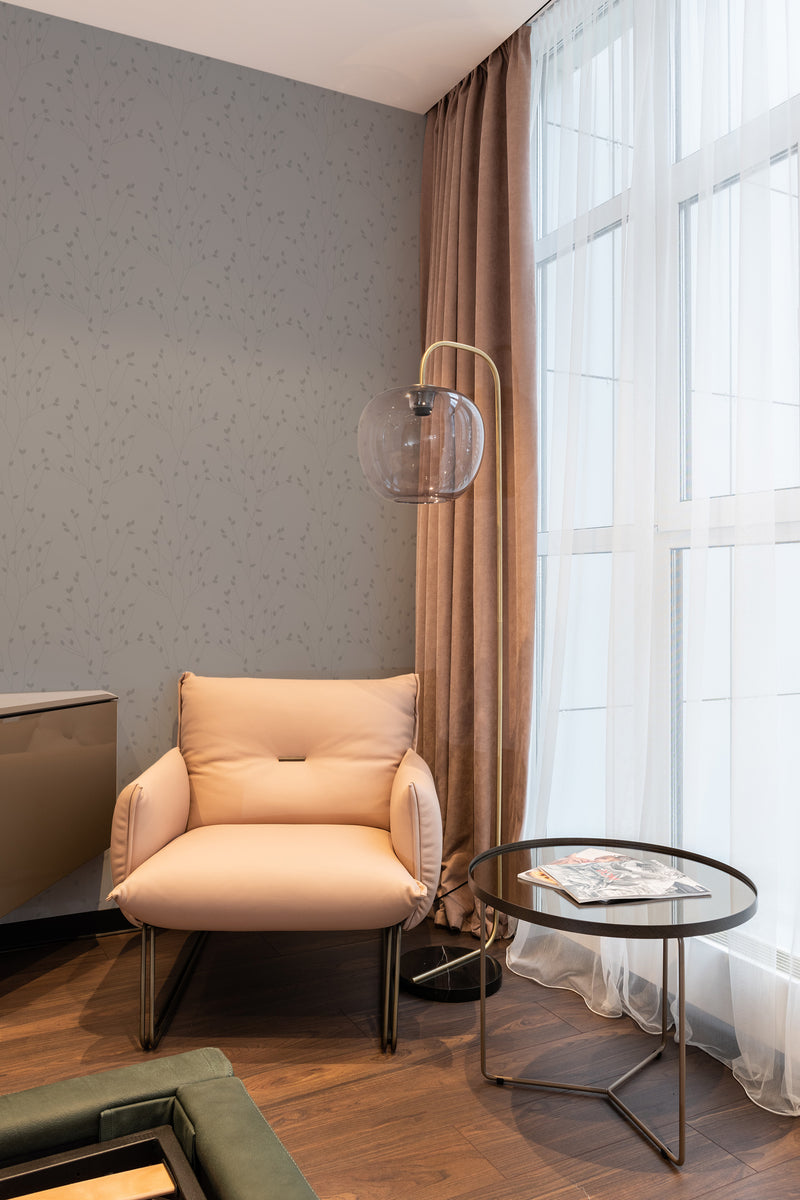 wallpaper stick and peel minimal tree pattern modern armchair lamp table reading area