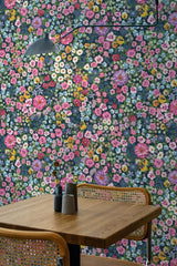 wooden dining table rattan chairs colorful bold floral peel and stick wallpaper