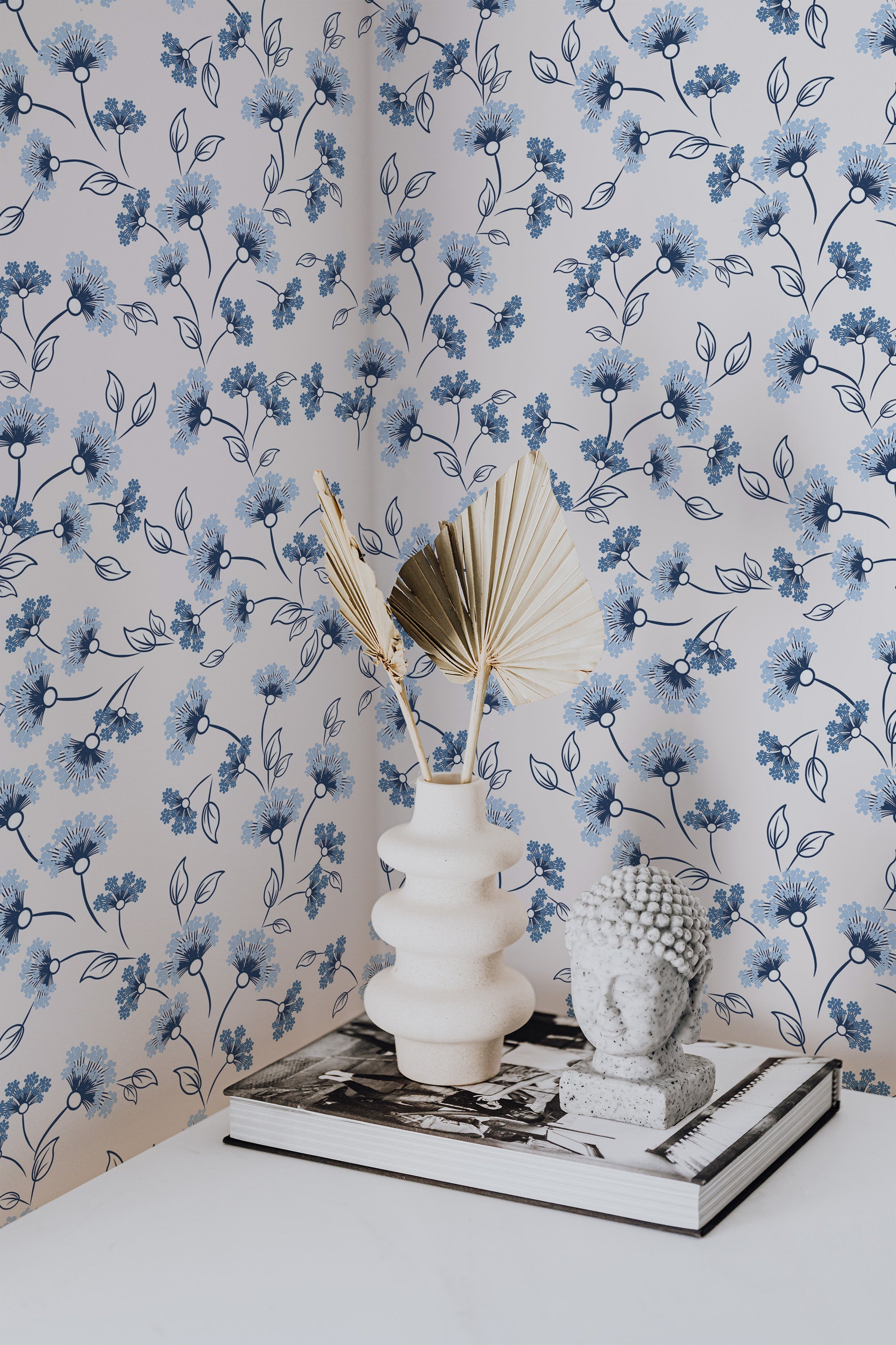 Self-adhesive wallpaper with a Bluebottle design of delicate blue flowers and leafy branches on a white background, creating a soft and serene floral pattern.