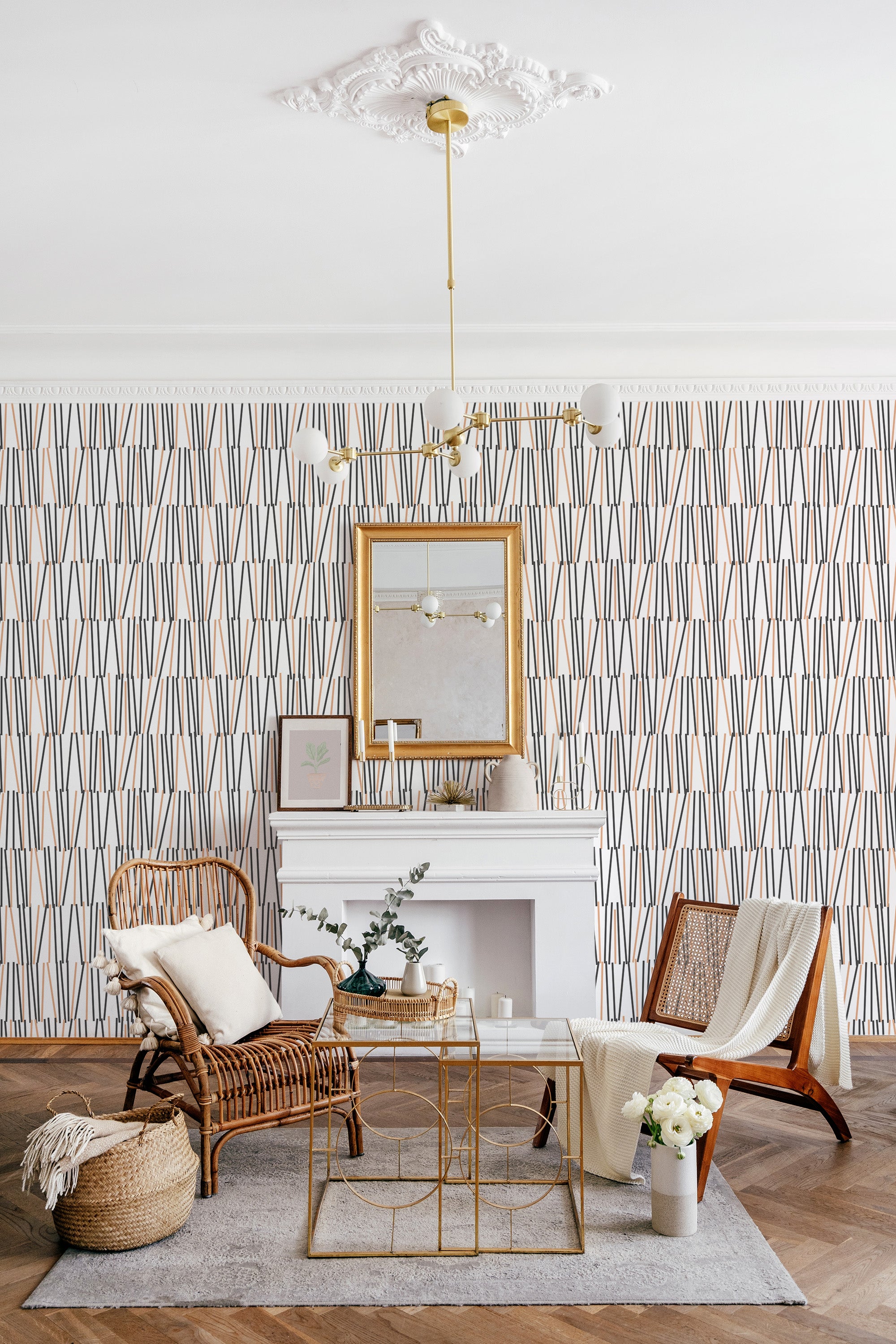 Line art design wallpaper with vertical linear patterns in muted tones of blue and beige, adding a modern yet subtle aesthetic to a cozy, traditionally furnished room with rattan seating. Traditional wallpaper.