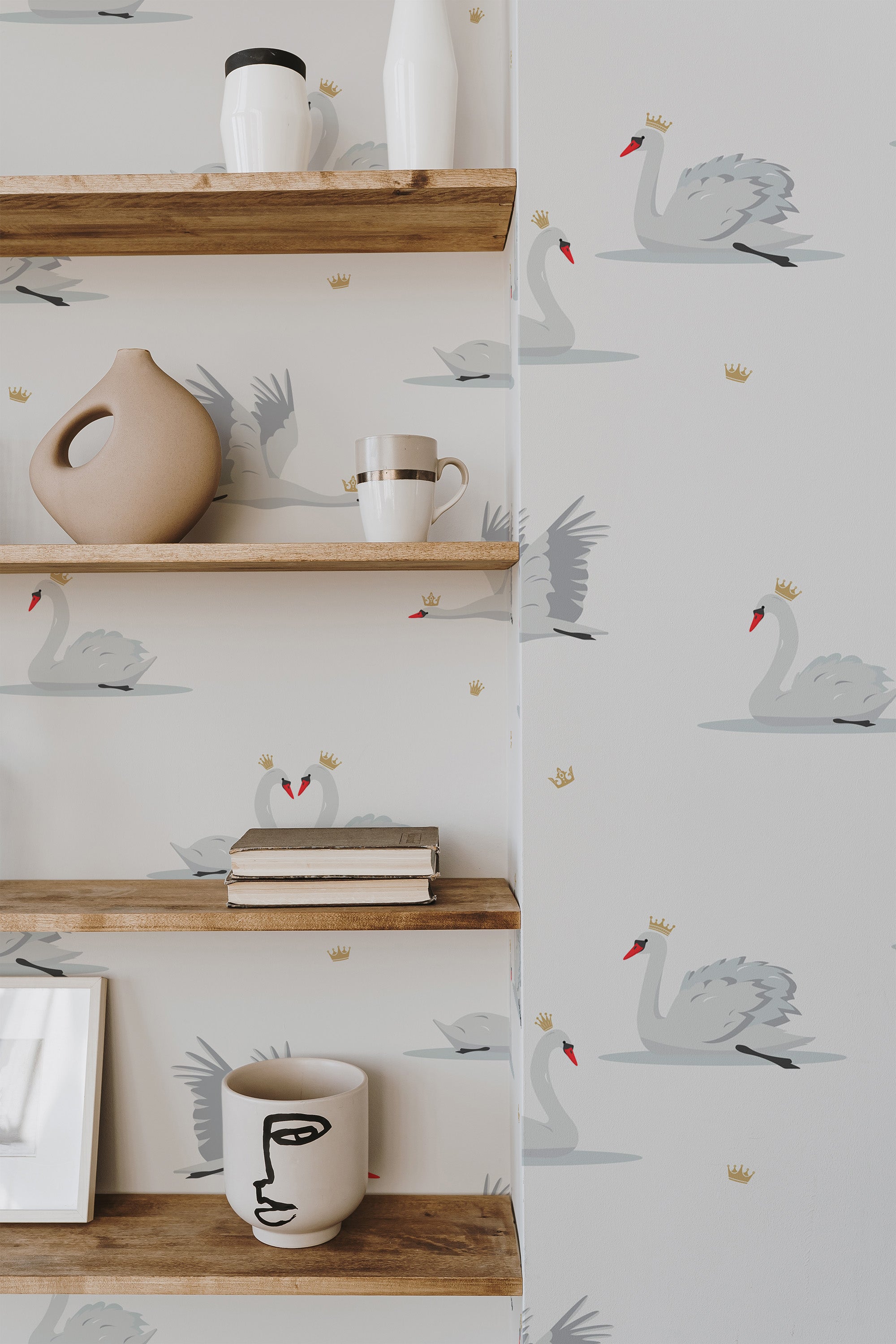 Self-adhesive wallpaper adorned with elegant swans and small crown accents on a white background.