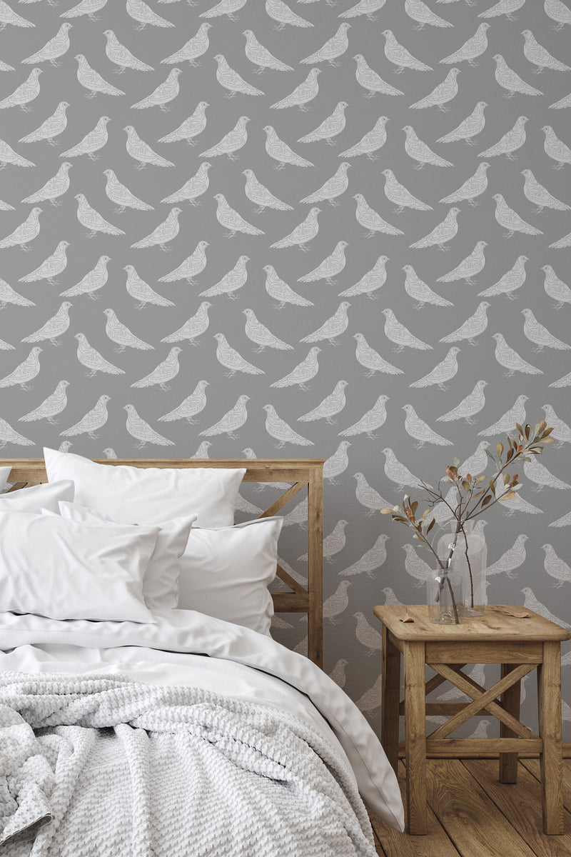 Self-adhesive wallpaper with a repeating pattern of white pigeons on a gray background, adding a subtle yet stylish touch to the room's decor.