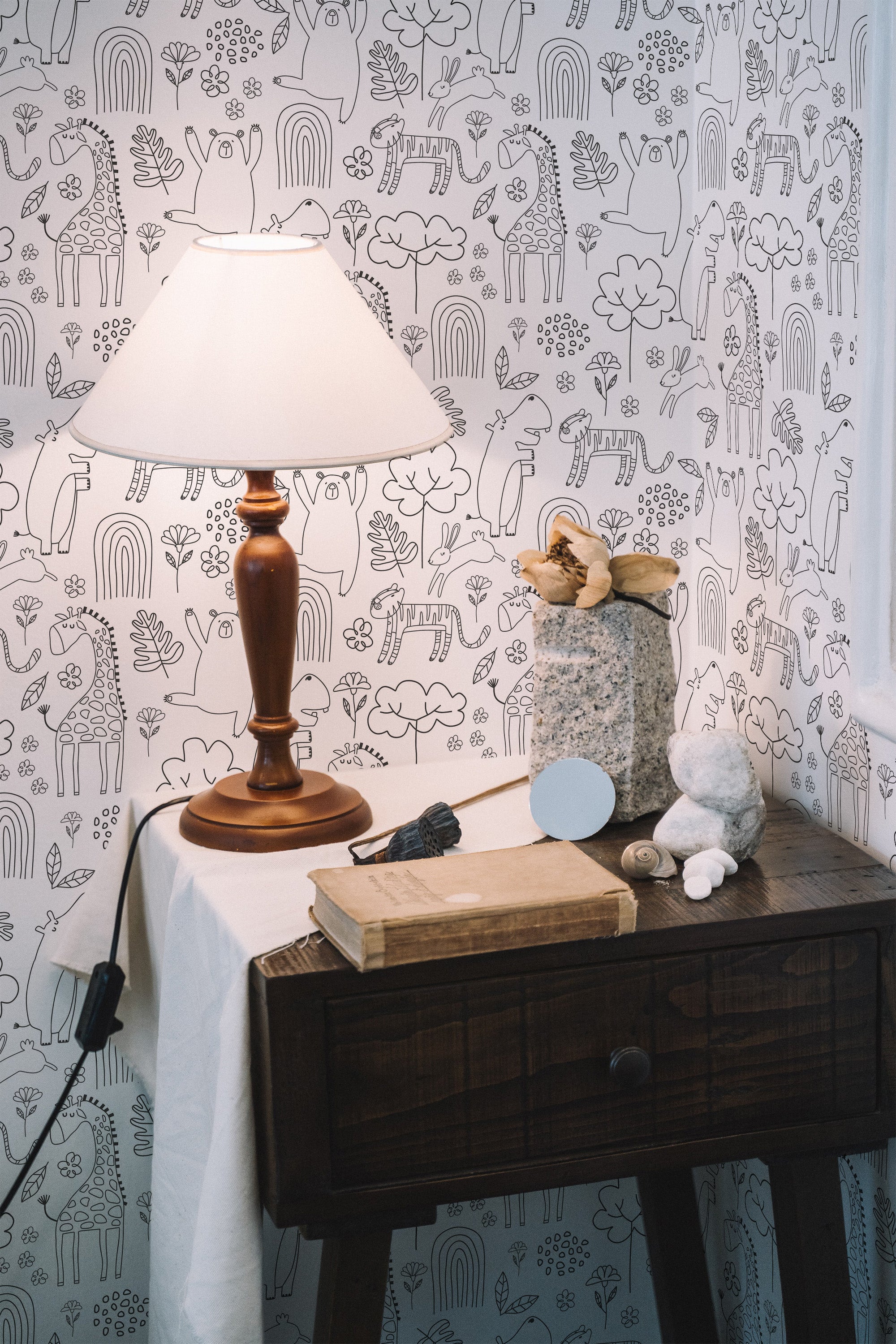 Self-adhesive wallpaper with a whimsical animal print design, featuring line drawings of various animals, plants, and trees in a repetitive pattern on a light background.