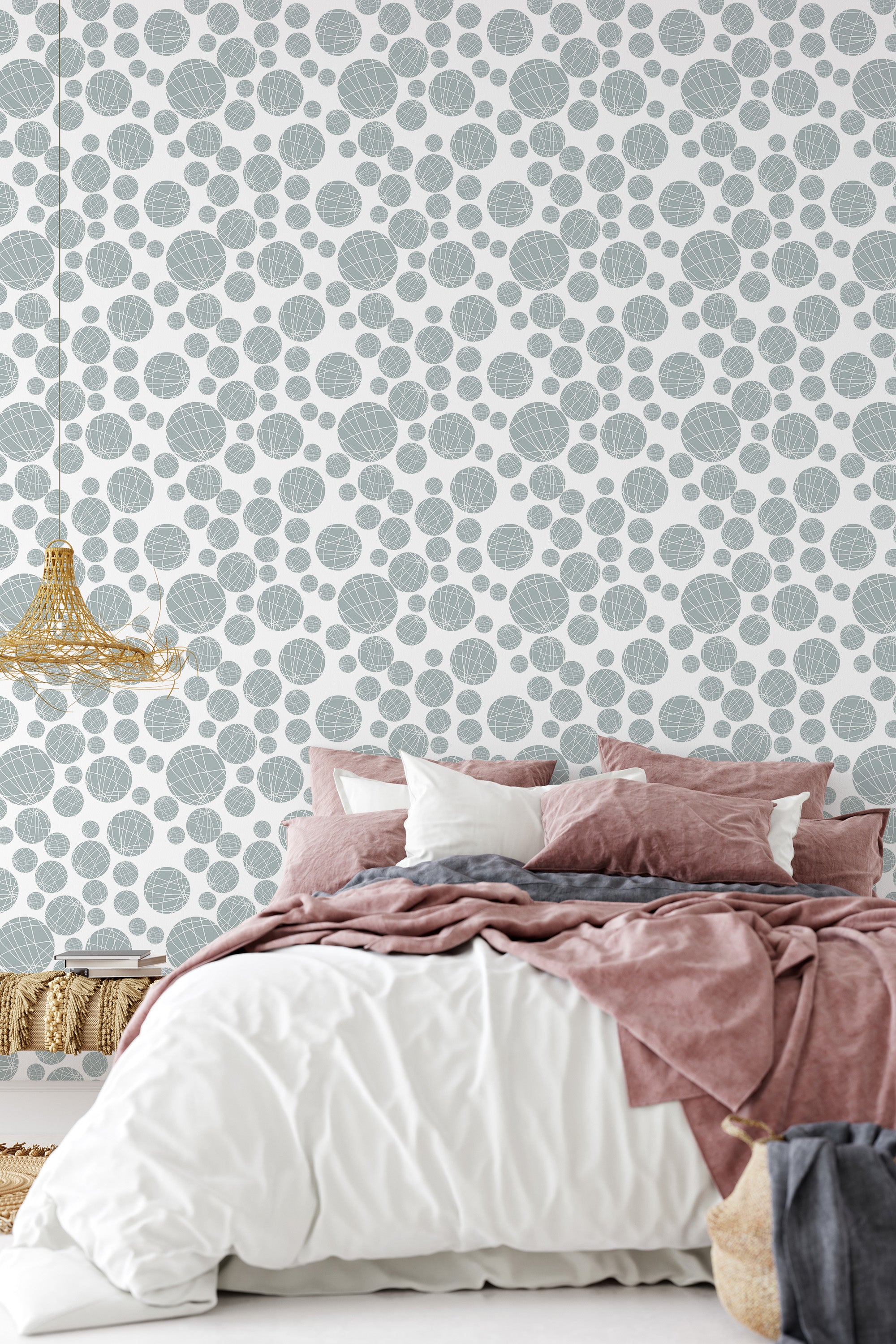 The wallpaper design involves an arrangement of seamless circles in varying sizes, with a delicate texture that gives a harmonious and patterned look. The circles are set against a light background, creating a modern yet understated geometric pattern that enhances the room���s ambiance while maintaining the essence of traditional wallpaper.