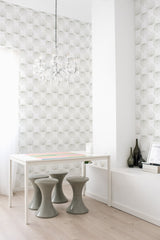 Room with light-colored walls adorned with delicate French leaf pattern wallpaper. Traditional wallpaper.