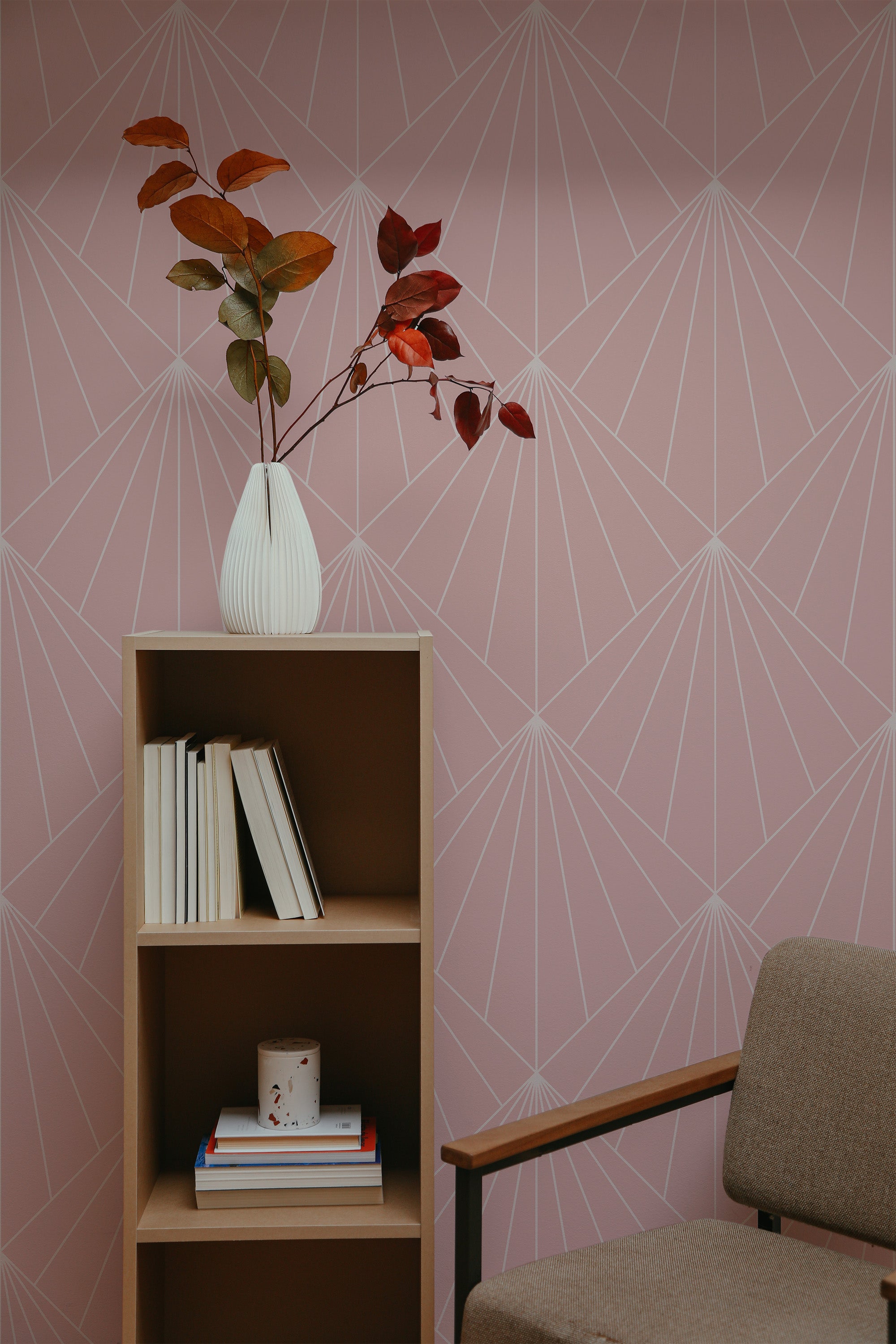 Self-adhesive wallpaper with a Solid art Deco design, showing elegant pale geometric lines forming a fan-like pattern on a soft pink background.