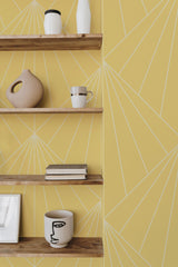 Self-adhesive wallpaper with an Art Deco geometric sun design in a light yellow hue, featuring minimalist white lines radiating outward in a sunburst pattern.